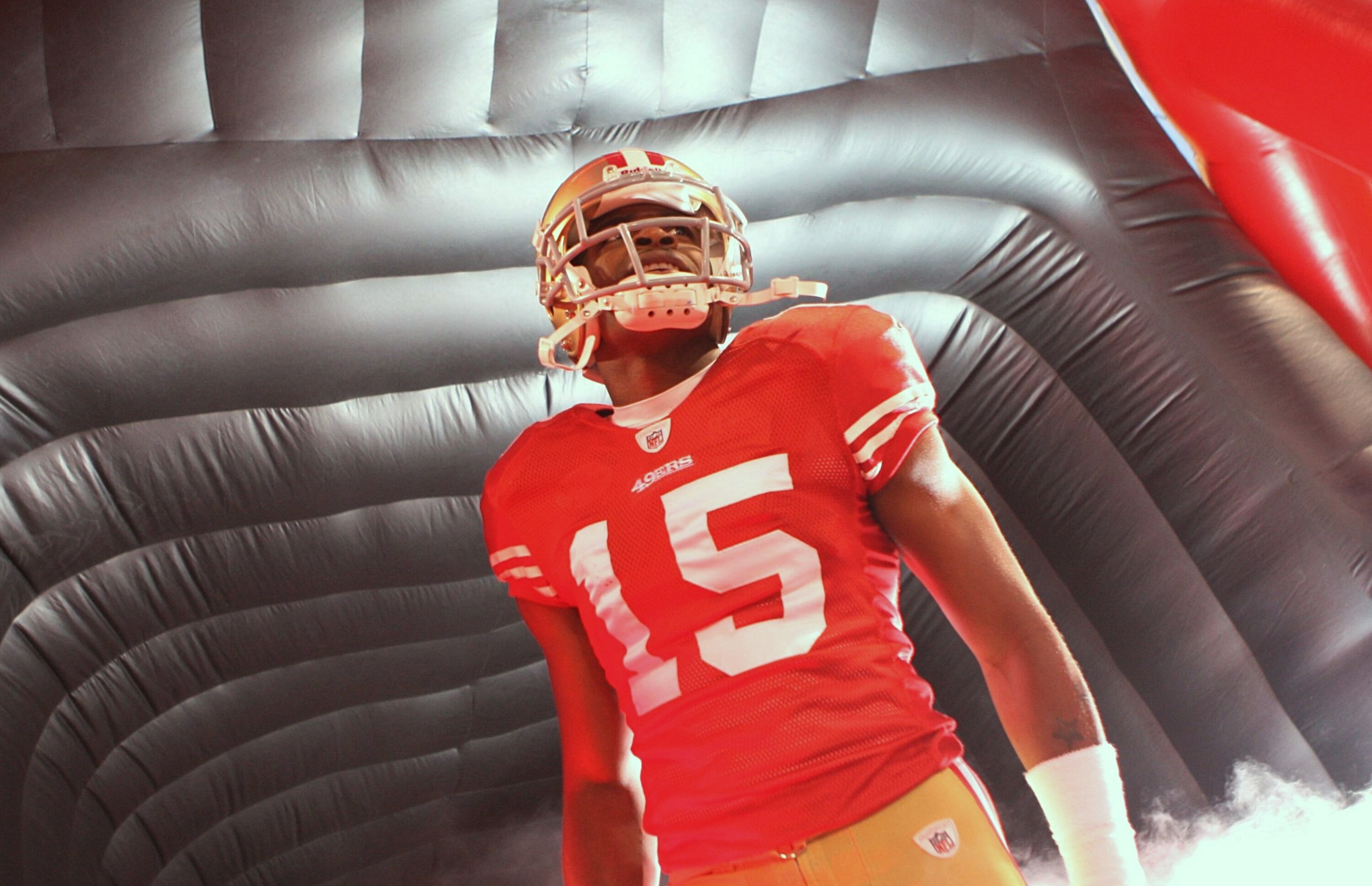SAN FRANCISCO - NOVEMBER 12:  Michael Crabtree #15 of the San Francisco 49ers looks on during player introductions against the Chicago Bears at Candlestick Park on November 12, 2009 in San Francisco, California.  (Photo by Jed Jacobsohn/Getty Images)