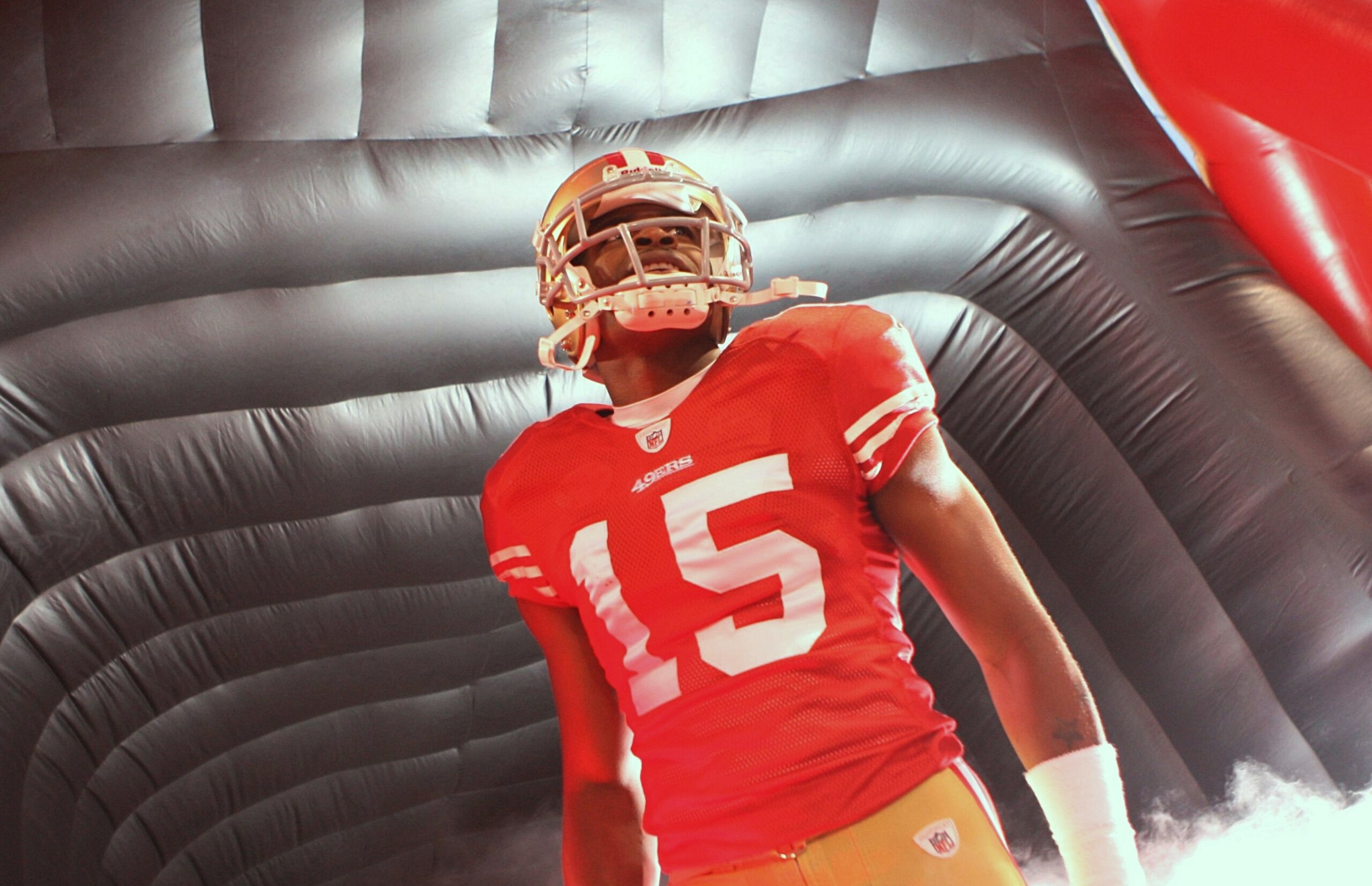 SAN FRANCISCO - NOVEMBER 12:  Michael Crabtree #15 of the San Francisco 49ers looks on during player introductions against the Chicago Bears at Candlestick Park on November 12, 2009 in San Francisco, California.  (Photo by Jed Jacobsohn/Getty Images)
