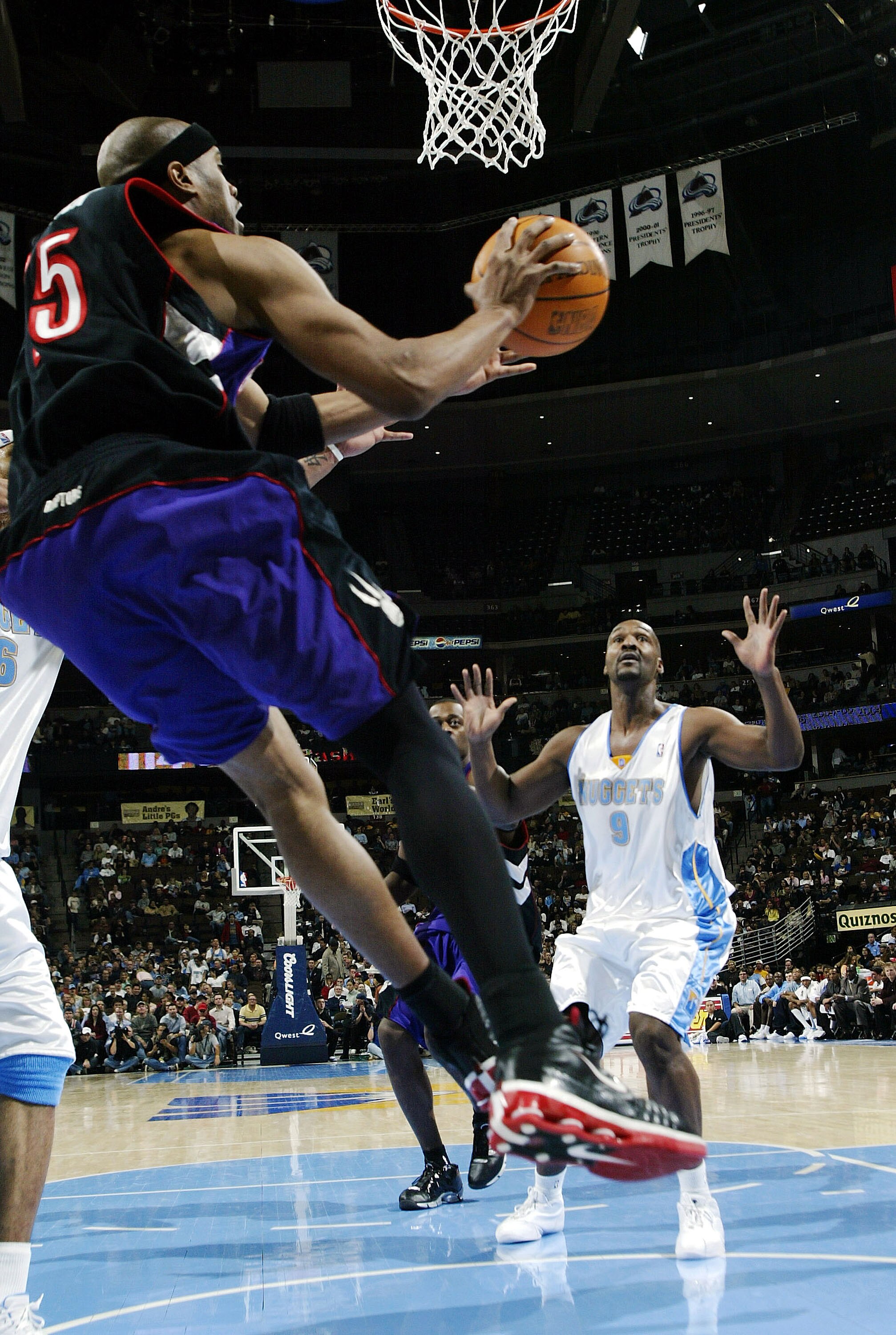 DENVER - NOVEMBER 17:  Vince Carter #15 of the Toronto Raptors works under the basket against the Denver Nuggets during the second half of NBA action on November 17, 2004 at the Pepsi Center in Denver, Colorado.  The Nuggets won the game 112-106.  NOTE TO