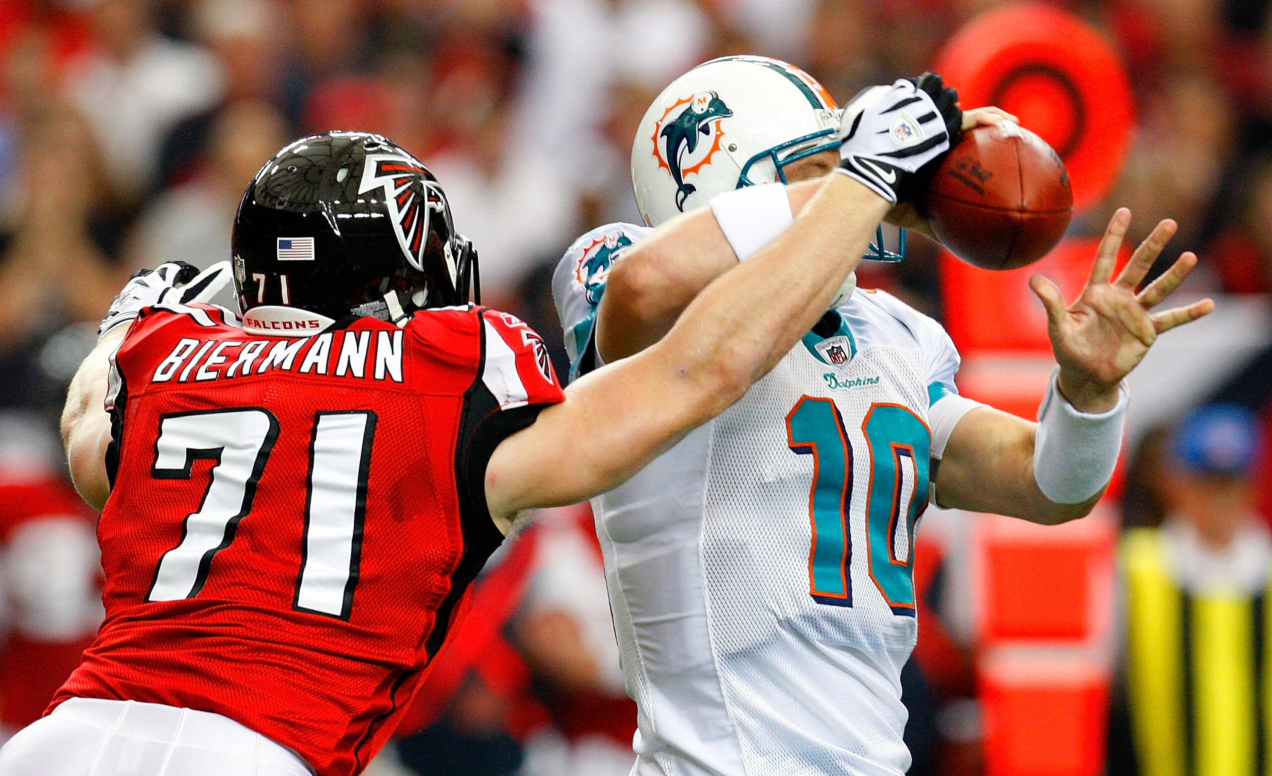 ATLANTA - SEPTEMBER 13:  Kroy Biermann #71 of the Atlanta Falcons forces a fumble by quarterback Chad Pennington #10 of the Miami Dolphins at Georgia Dome on September 13, 2009 in Atlanta, Georgia.  (Photo by Kevin C. Cox/Getty Images)