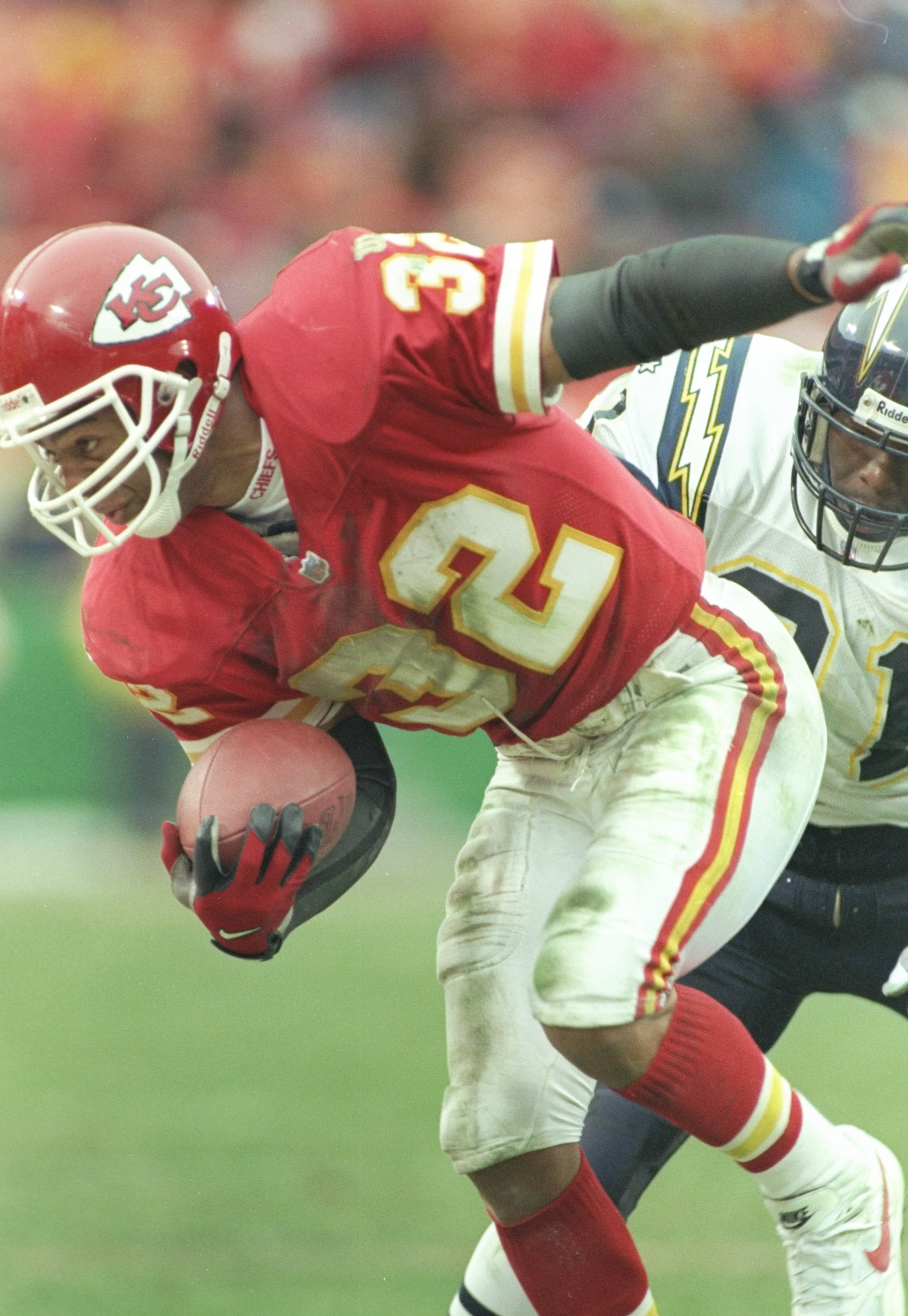 24 Nov 1996:  Running back Marcus Allen (32) of the Kansas City Chiefs runs past the  San Diego Chargers defense during the third quarter at Arrowhead Stadium in Kansas City, Missouri.   Mandatory Credit: Jamie Squire/ALLSPORT