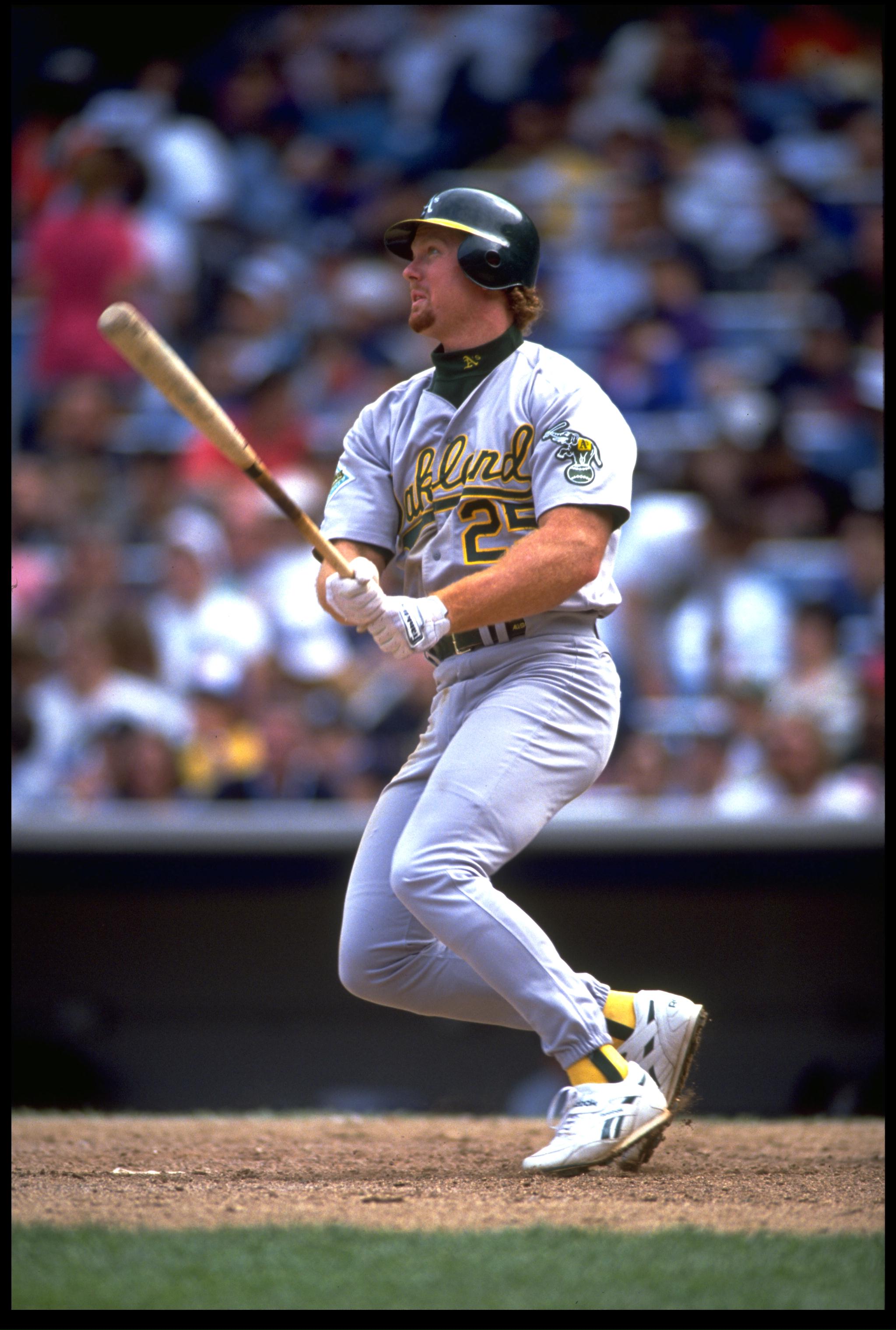 OAKLAND A''S FIRST BASEMAN MARK MCGWIRE MAKES CONTACT WITH A PITCH DURING THE A''S VERSUS CALIFORNIA ANGELS GAME AT ANAHEIM STADIUM IN ANAHEIM, CALIFORNIA. MANDATORY CREDIT: KEN LEVINE/ALLSPOR