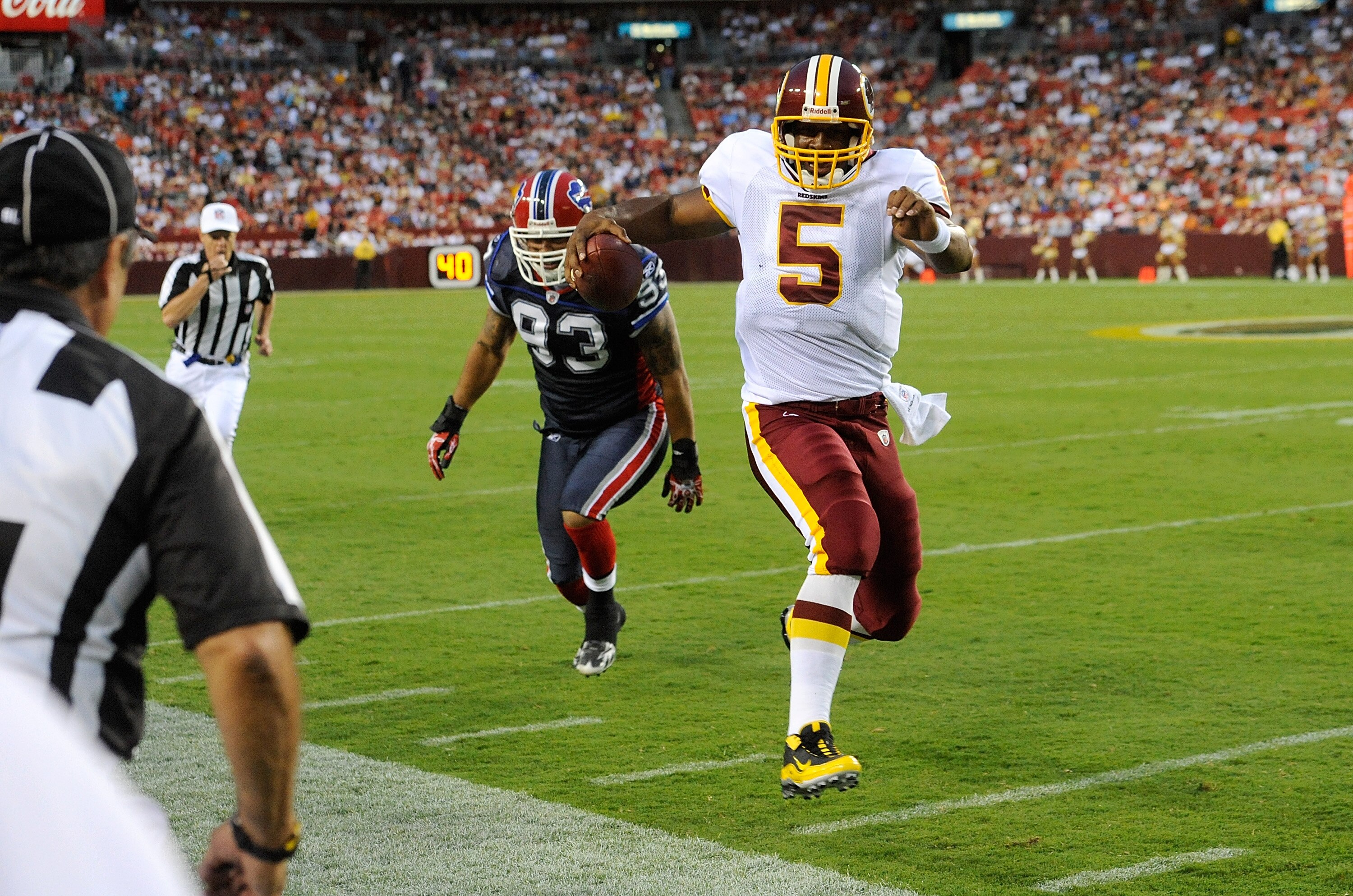 LANDOVER, MD - AUGUST 13:  Donovan McNabb #5 of the Washington Redskins runs out of bounds for a first down during the preseason game against the Buffalo Bills at FedEx Field on August 13, 2010 in Landover, Maryland.  (Photo by Greg Fiume/Getty Images)