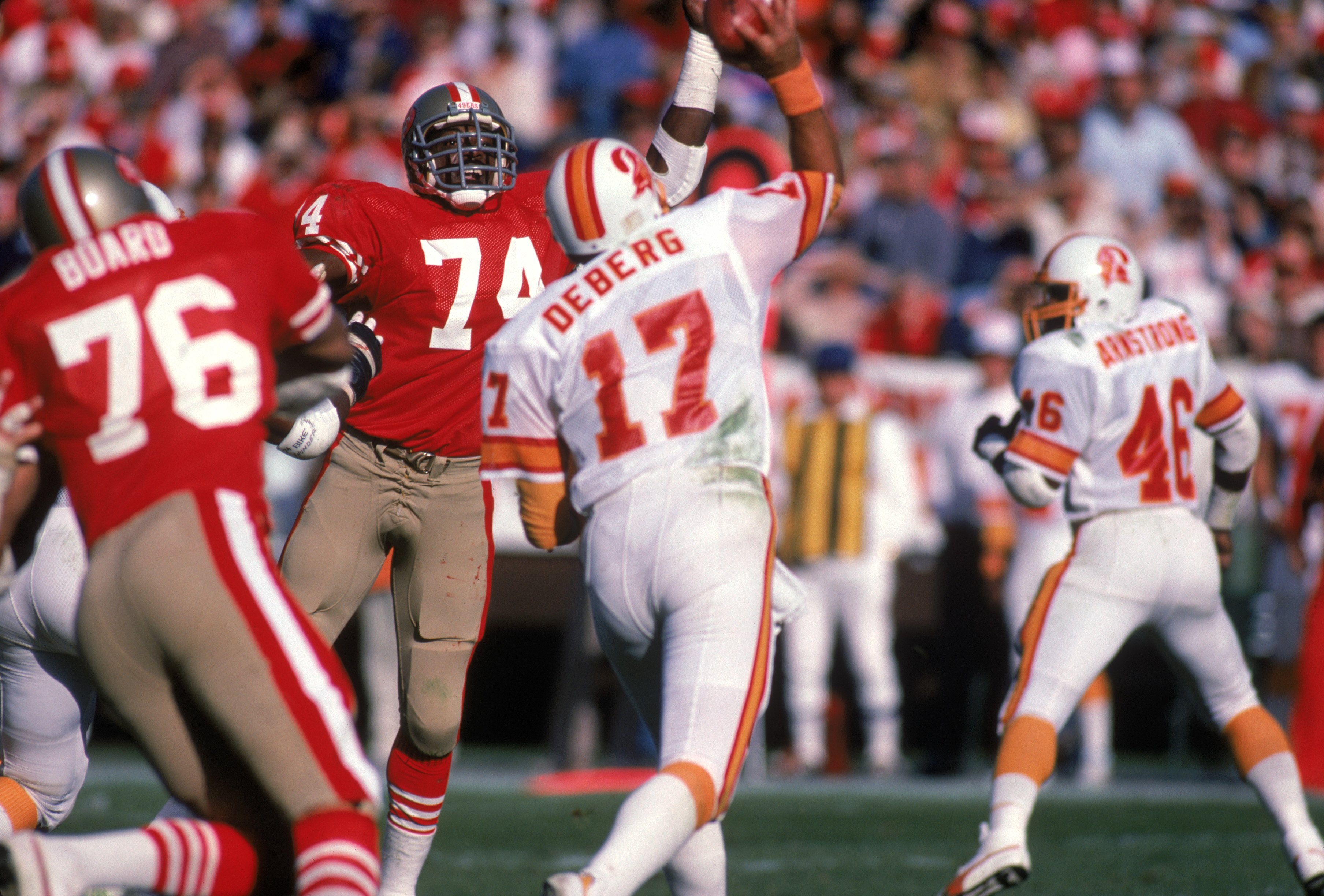 SAN FRANCISCO - NOVEMBER 18:  Defensive end Fred Dean #74 of the San Francisco 49ers raises his arm in an attempt to block a pass from Tampa Bay Buccaneers quarterback Steve DeBerg #17 during a game at Candlestick Park on November 18, 1984 in San Francisc