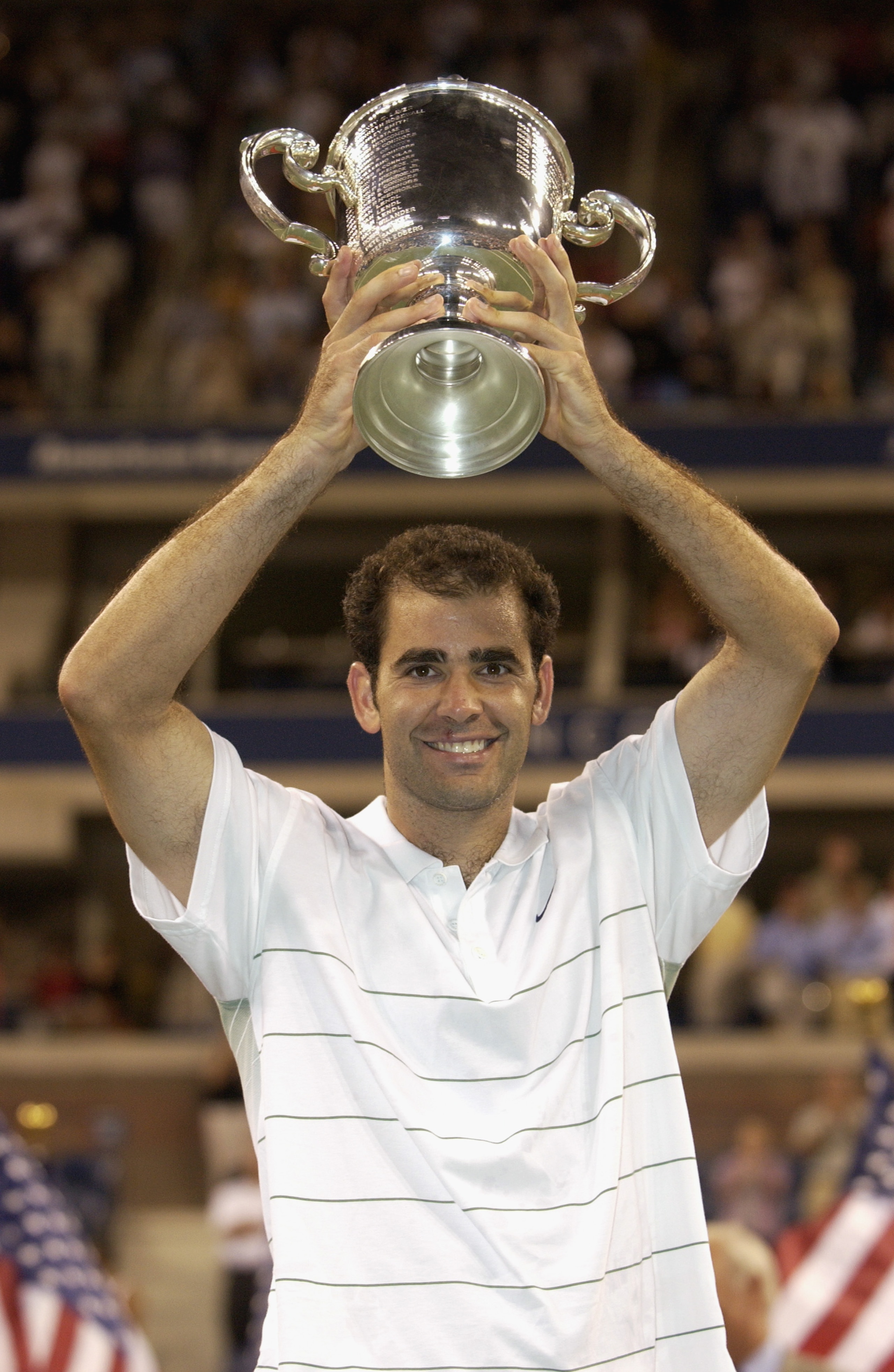 FLUSHING, NY - SEPTEMBER 8: Pete Sampras lifts his trophy during the US Open September 8, 2002 at the USTA National Tennis Center in Flushing Meadows Corona Park in Flushing, New York. Sampras is retiring in a brief ceremony at US Open August 25, 2003. FLUSHING, NY - SEPTEMBER 8: Pete Sampras lifts his trophy during the US Open September 8, 2002 at the USTA National Tennis Center in Flushing Meadows Corona Park in Flushing, New York. Sampras is retiring in a brief ceremony at US Open August 25, 2003.