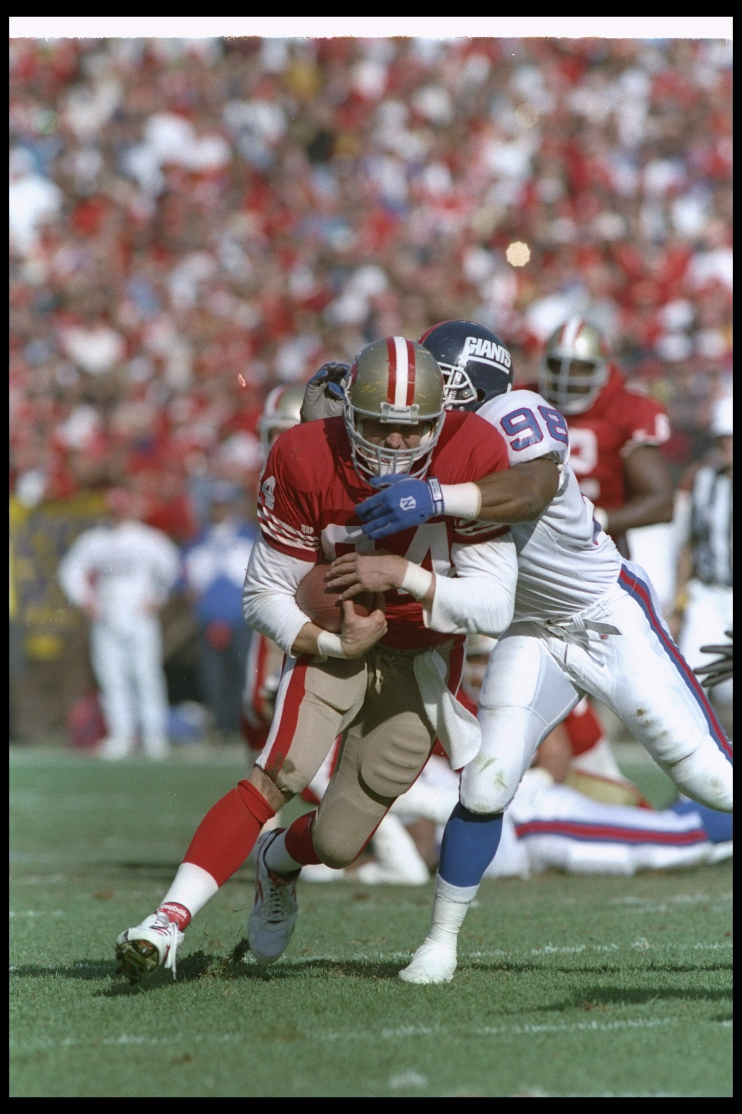 15 Jan 1994:  Tight end Brent Jones of the San Francisco 49ers gets tackled during a playoff game against the New York Giants at Candlestick Park in San Francisco, California.  The 49ers won the game, 44-3. Mandatory Credit: Mike Powell  /Allsport