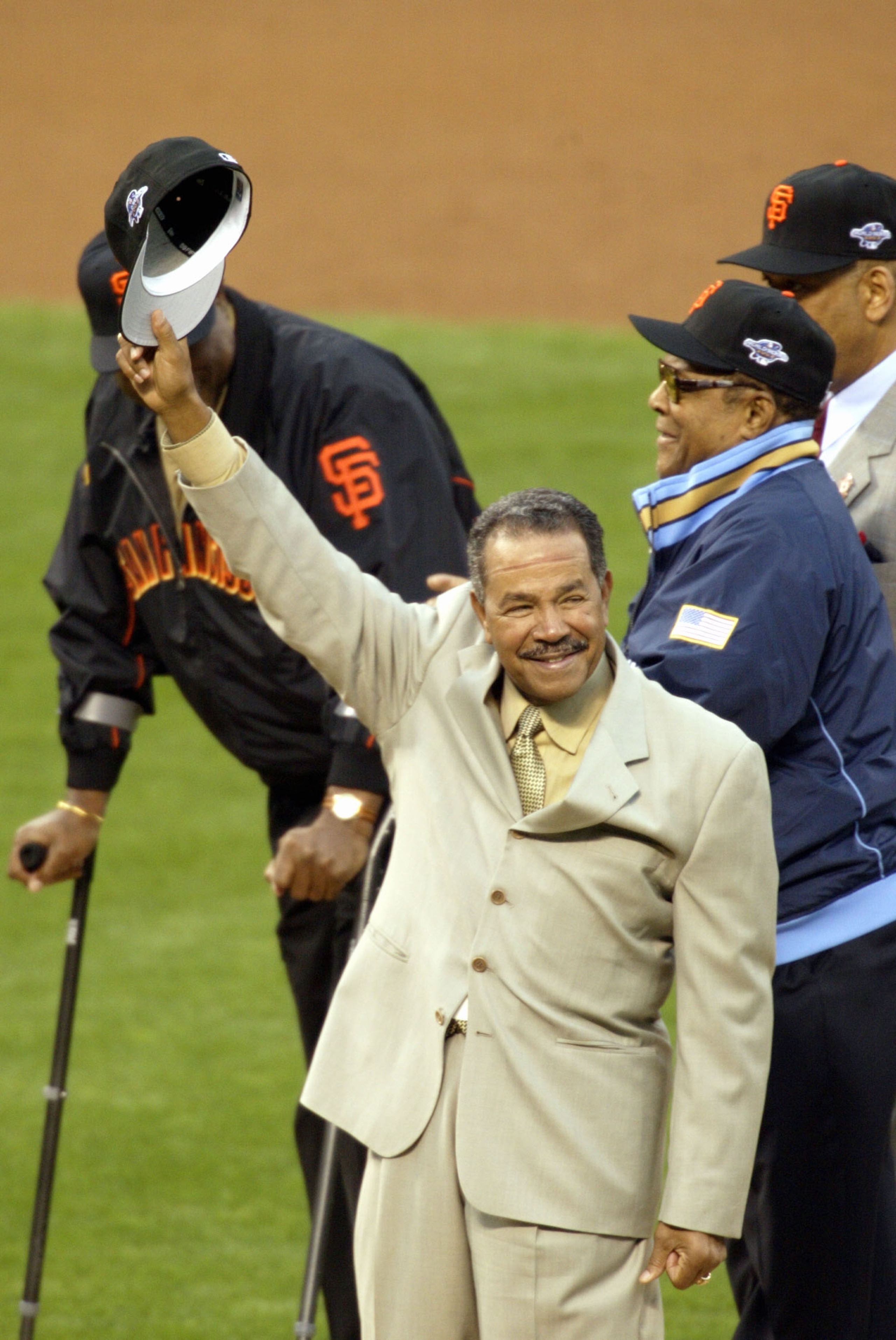 SAN FRANCISCO - OCTOBER 22:  Old time Giant Juan Marichal waves to the crowd before other former Giant Willie Mays throws out the ceremonial first pitch prior to the start of game three between the Anaheim Angels and the San Francisco Giants in the World