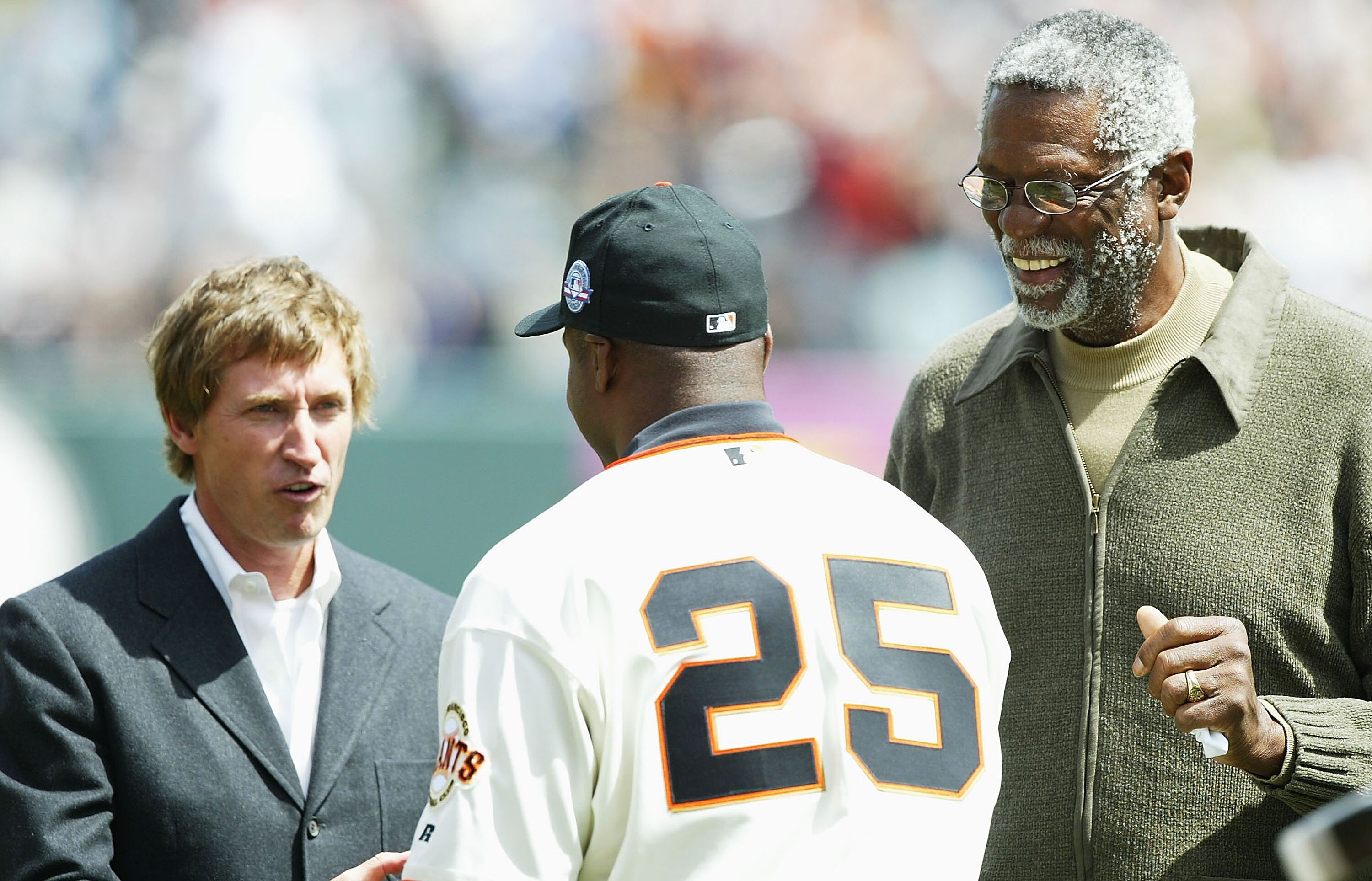 SAN FRANCISCO - APRIL 12:  Barry Bonds #25 of the San Francisco Giants accepts the 2003 MVP Trophy from Wayne Gretzky and Bill Russell before his game against the Milwaukee Brewers on April 12, 2004 at SBC Park in San Francsico, California.  (Photo by Jed