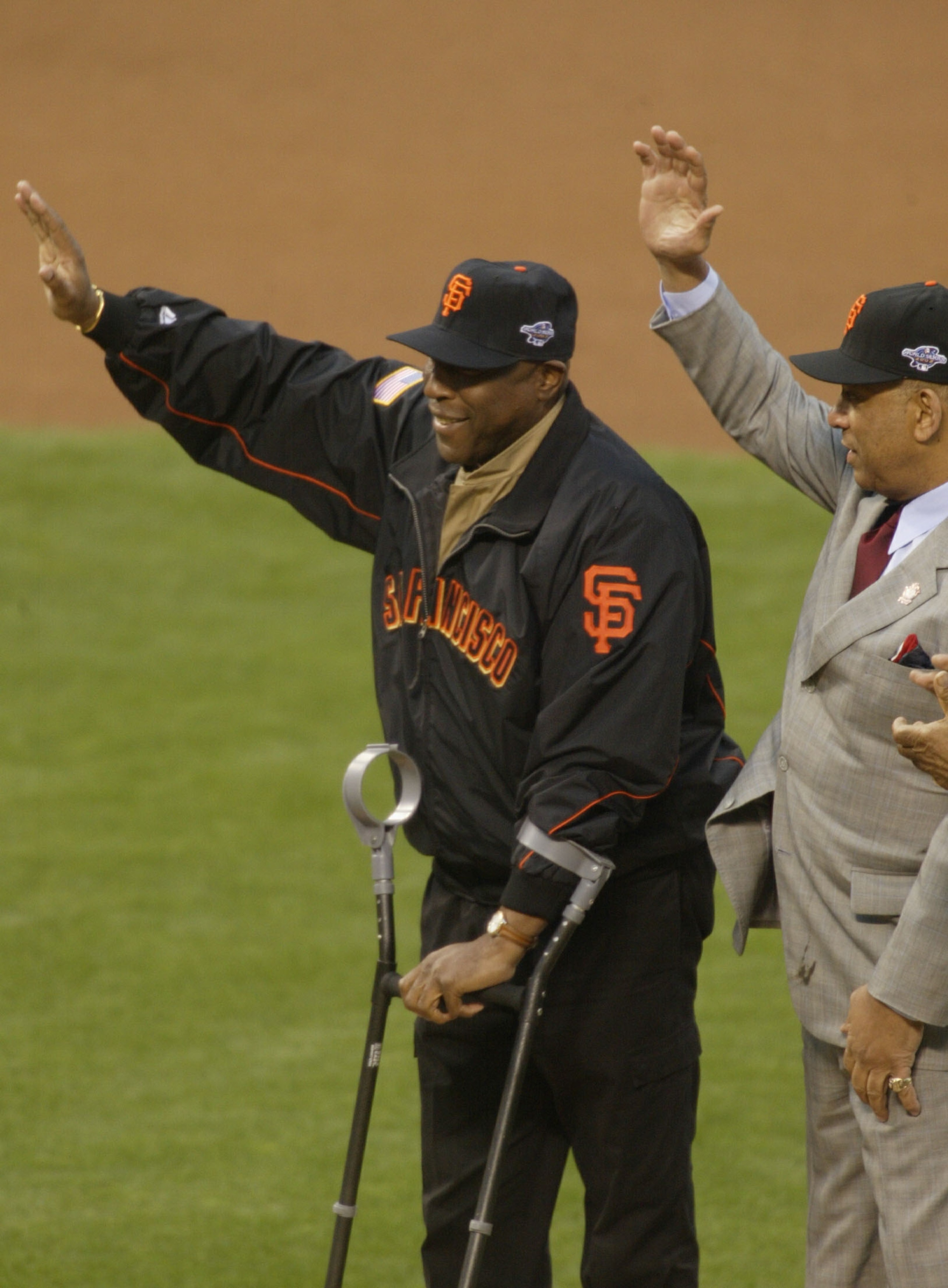 SAN FRANCISCO - OCTOBER 22:  Old time Giant Willie McCovey waves to the crowd before other former Giants Willie Mays throws out the ceremonial first pitch prior to the start of game three between the Anaheim Angels and the San Francisco Giants in the Worl