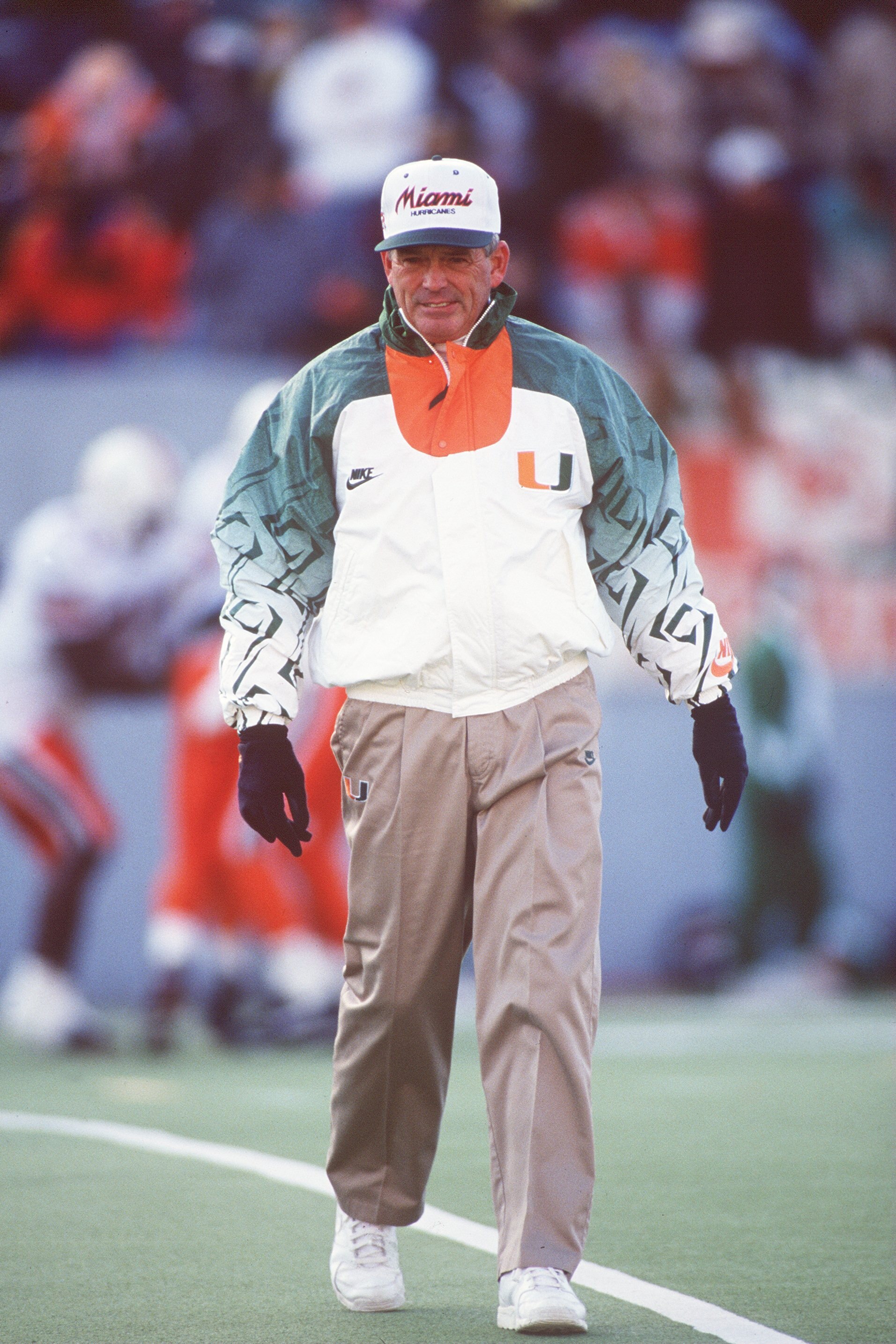 20 NOV 1993:  UNIVERSITY OF MIAMI HEAD COACH DENNIS ERICKSON WALKS OFF THE FIELD DURING THE HURRICANES 17-14 LOSS TO THE UNIVERSITY OF WEST VIRGINIA MOUNTAINEERS AT MOUNTAINEER FIELD IN MORGANTOWN, WEST VIRGINIA. Mandatory Credit: Doug Pensinger/ALLSPORT