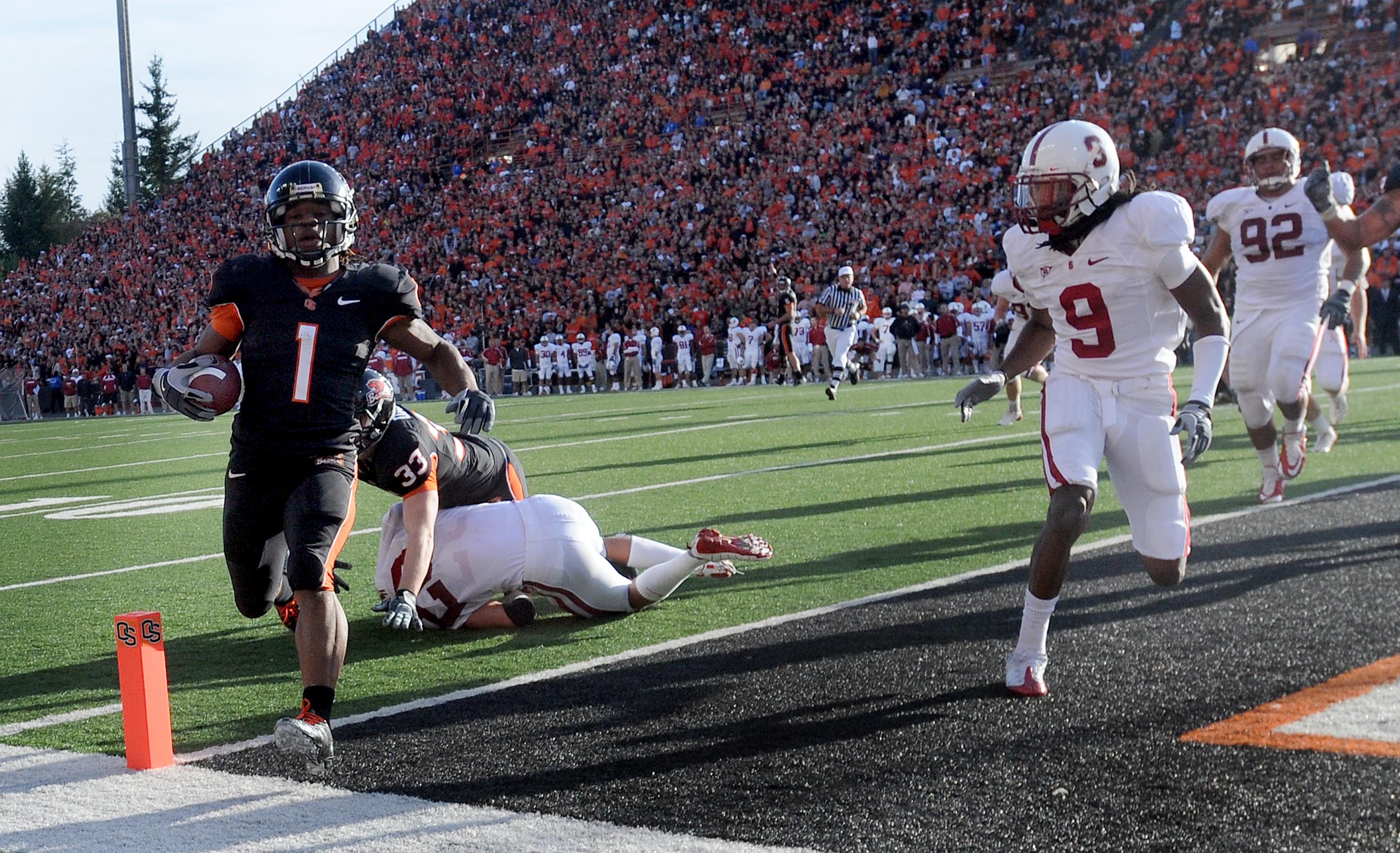 CORVALLIS, OR - OCTOBER 10: Running back Jacquizz Rodgers #1 of the Oregon State Beavers crosses the goal line for a touchdown as cornerback Richard Sherman #9 of the Stanford  Cardinals closes in during the second quarter of the game at Reser Stadium on
