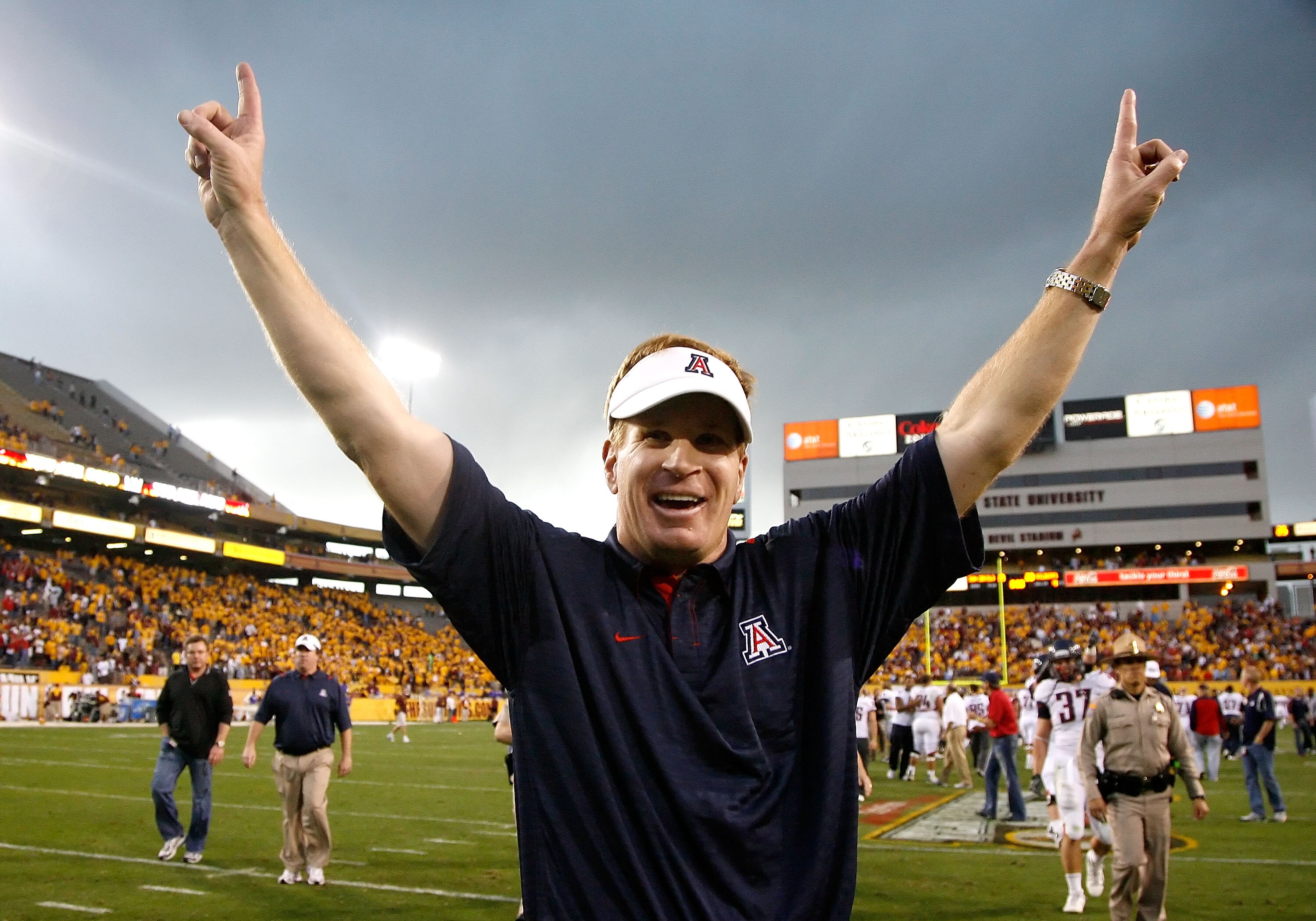 TEMPE, AZ - NOVEMBER 28:  Head coach Mike Stoops of the Arizona Wildcats celebrates after defeating the Arizona State Sun Devils in the college football game at Sun Devil Stadium on November 28, 2009 in Tempe, Arizona.  The Wildcats defeated the Sun Devil