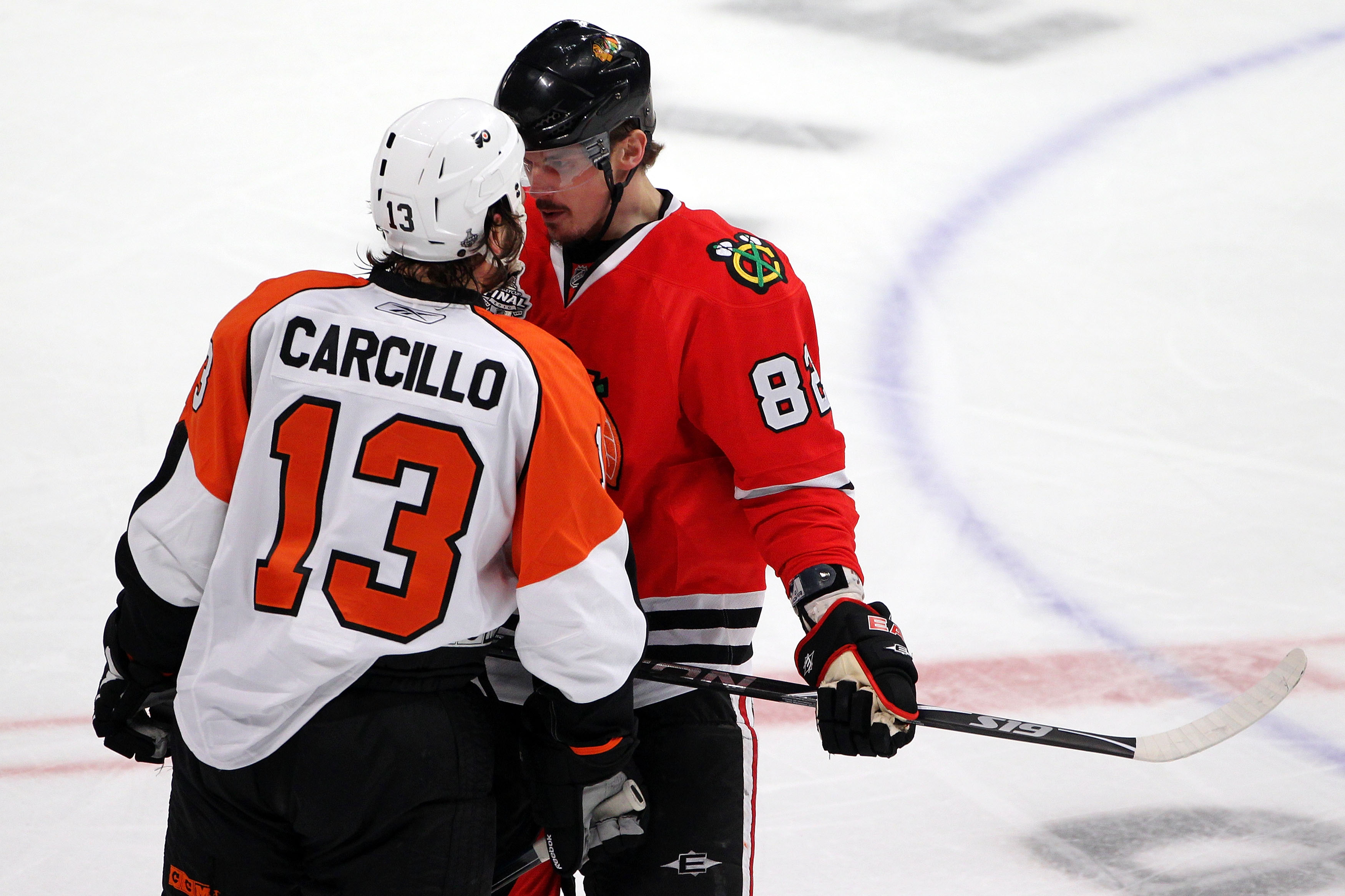 CHICAGO - MAY 31:  Tomas Kopecky #82 of the Chicago Blackhawks has words wit Daniel Carcillo #13 of the Philadelphia Flyers in Game Two of the 2010 NHL Stanley Cup Final at the United Center on May 31, 2010 in Chicago, Illinois.  (Photo by Andre Ringuette