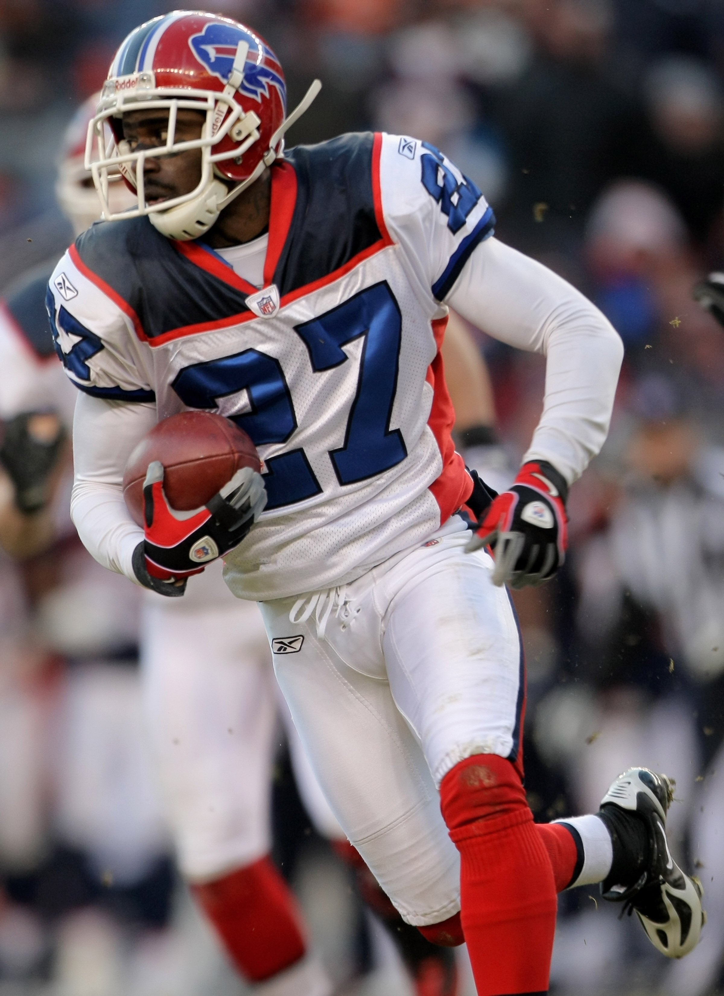 DENVER - DECEMBER 21:  Reggie Corner #27 of the Buffalo Bills returns a fumble by Brandon Marshall #15 of the Denver Broncos in the third quarter during NFL action at Invesco Field at Mile High on December 21, 2008 in Denver, Colorado. The Bills defeated 