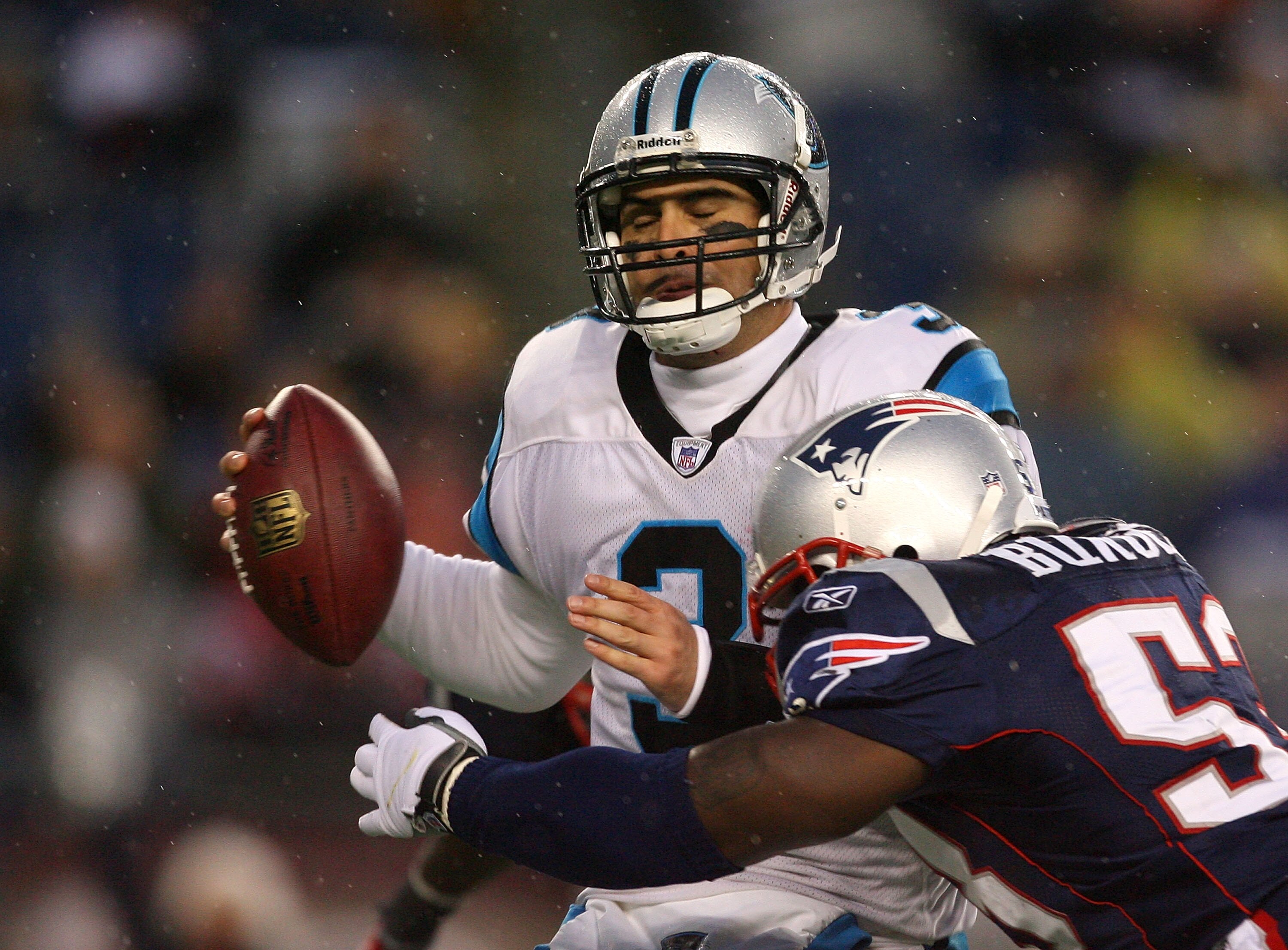 FOXBORO, MA - DECEMBER 13:  Matt Moore #3 of the Carolina Panthers is sacked in the fourth quarter by Derrick Burgess #53 of the New England Patriots at Gillette Stadium on December 13, 2009 in Foxboro, Massachusetts. The Patriots won 20-10.  (Photo by Ji