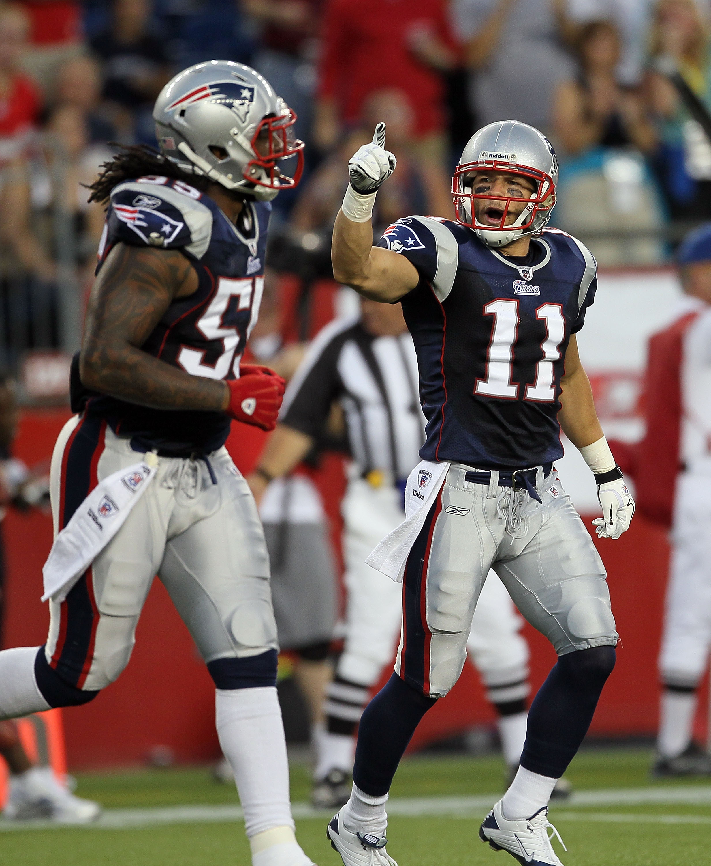 FOXBORO, MA - AUGUST 12: Brandon Spikes #55 and Julian Edelman #11 of the New England Patriots react in the first quarter during the preseason game against the New Orleans Saints at Gillette Stadium on August 12, 2010 in Foxboro, Massachusetts. (Photo by 
