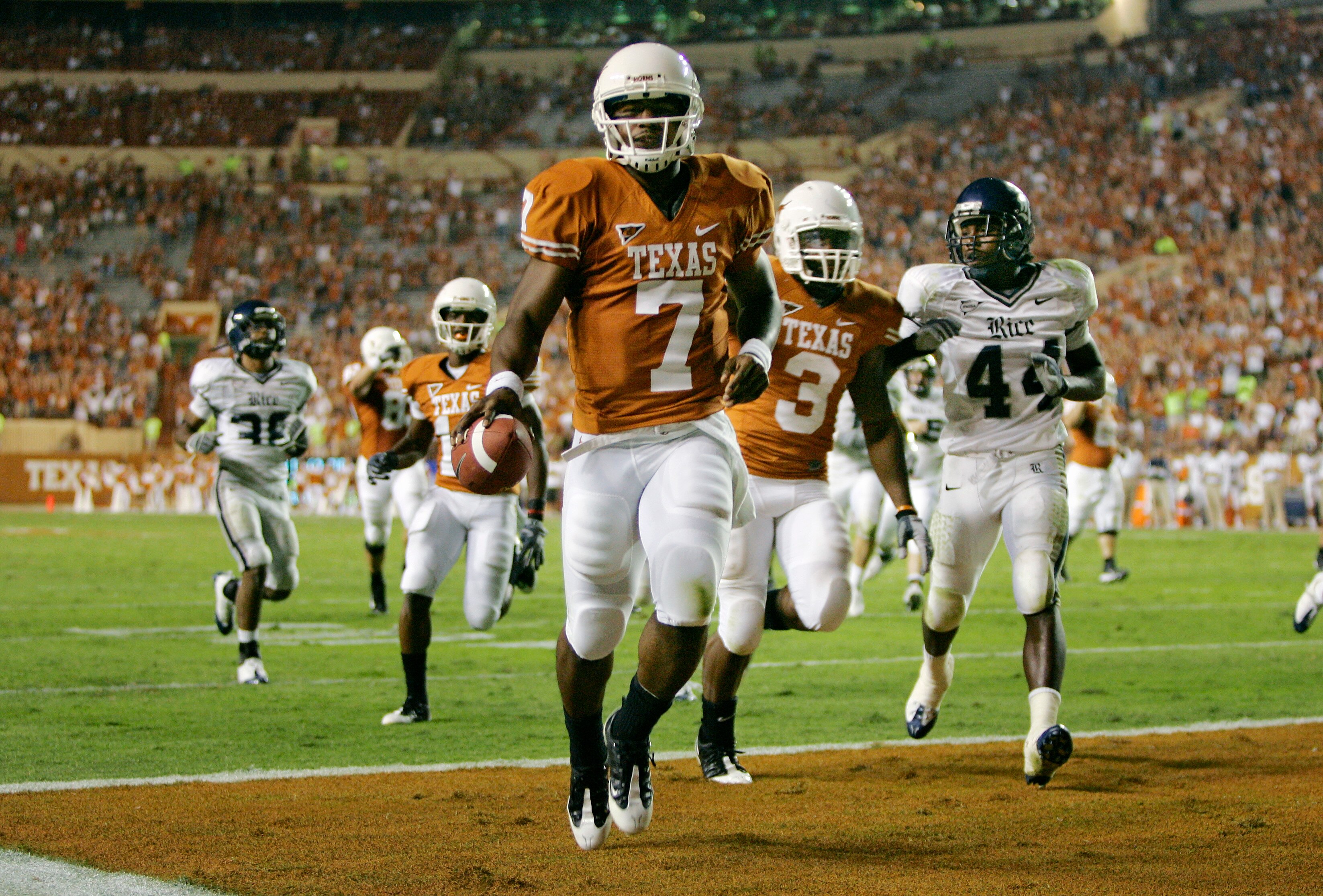 AUSTIN, TX - SEPTEMBER 20:  Quarterback John Chiles #7 of the Texas Longhorns runs to the corner for a touchdown against the Rice Owls in the fourth quarter on September 20, 2008 at Darrell K Royal-Texas Memorial Stadium in Austin, Texas.  Texas won 52-10