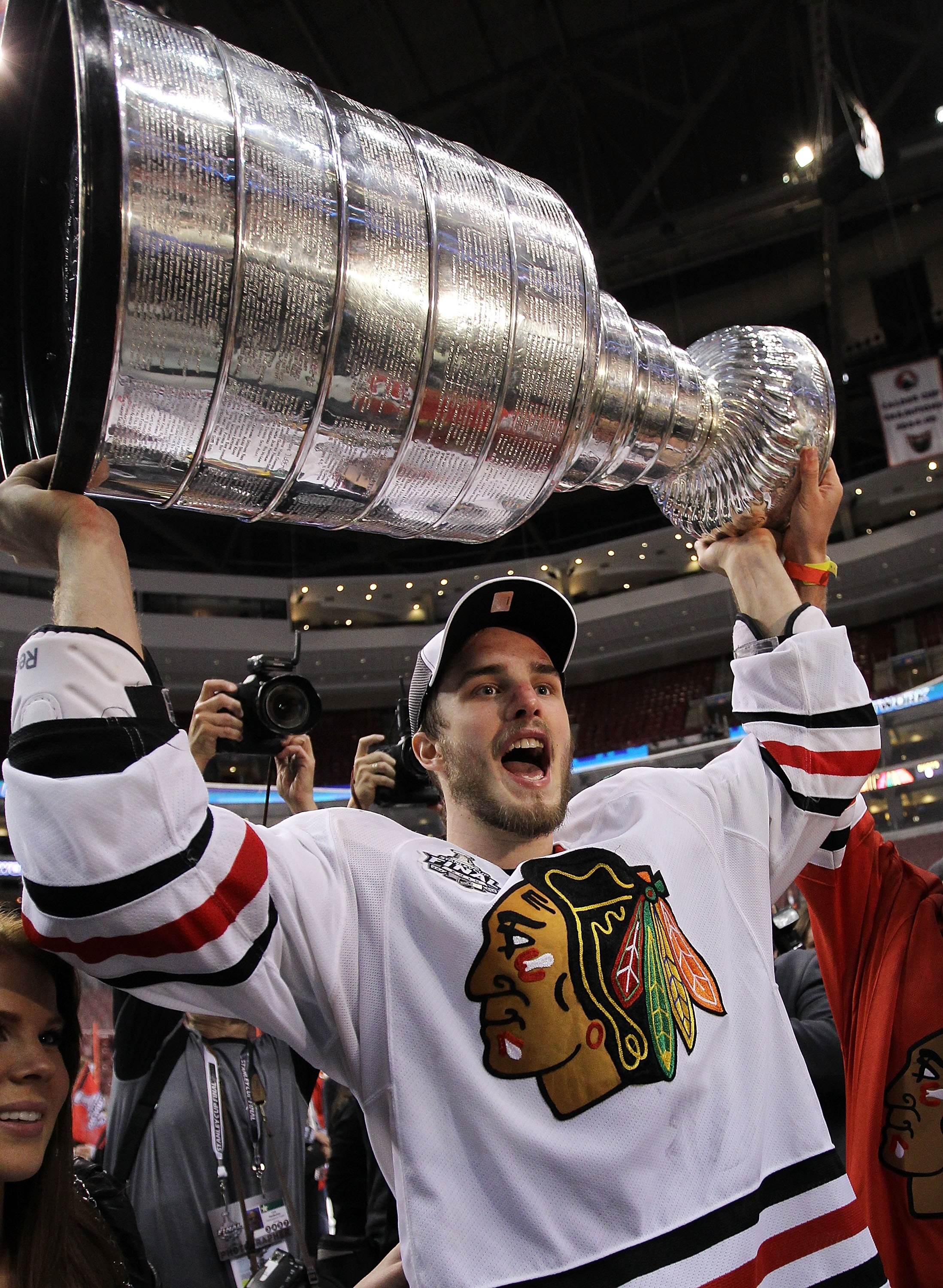 PHILADELPHIA - JUNE 09: Niklas Hjalmarsson #4 of the Chicago Blackhawks hoists the Stanley Cup after the Blackhawks defeated the Philadelphia Flyers 4-3 in overtime to win the Stanley Cup in Game Six of the 2010 NHL Stanley Cup Final at the Wachovia Cente