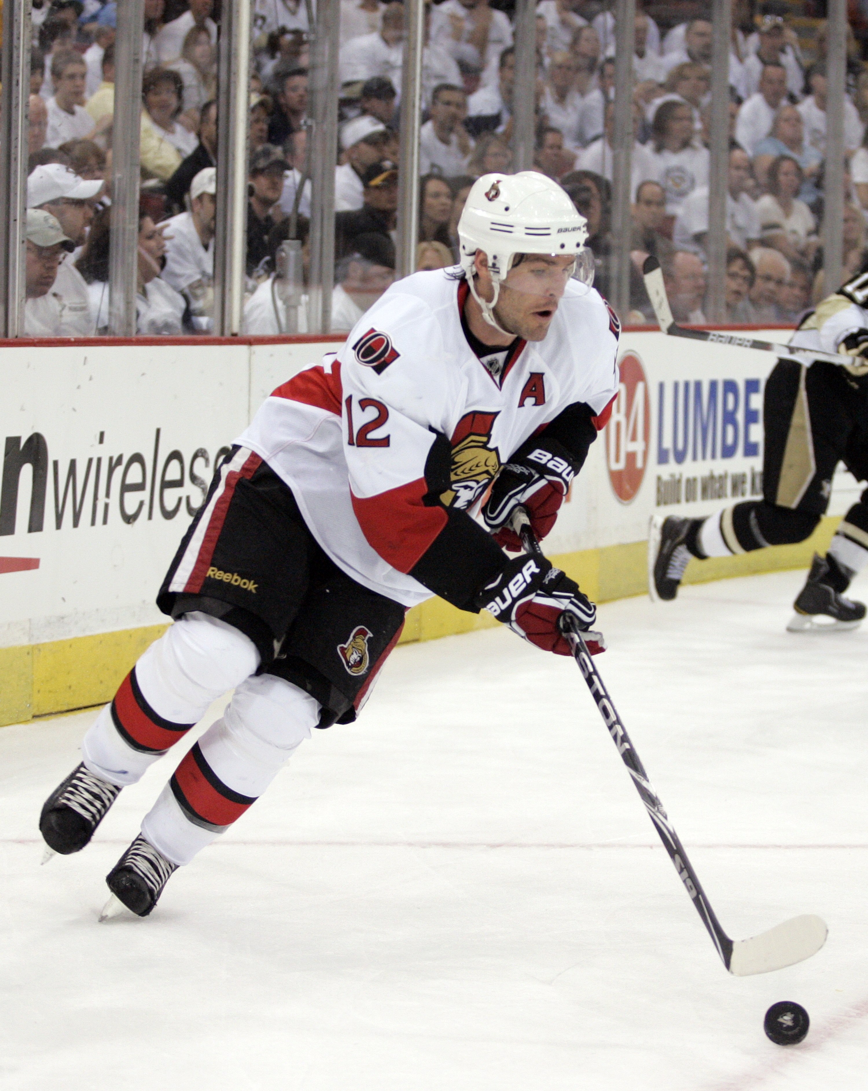 PITTSBURGH - APRIL 16:  Mike Fisher #12 of the Ottawa Senators handles the puck against the Pittsburgh Penguins in Game Two of the Eastern Conference Quarterfinals during the 2010 NHL Stanley Cup Playoffs at Mellon Arena on April 16, 2010 in Pittsburgh, P