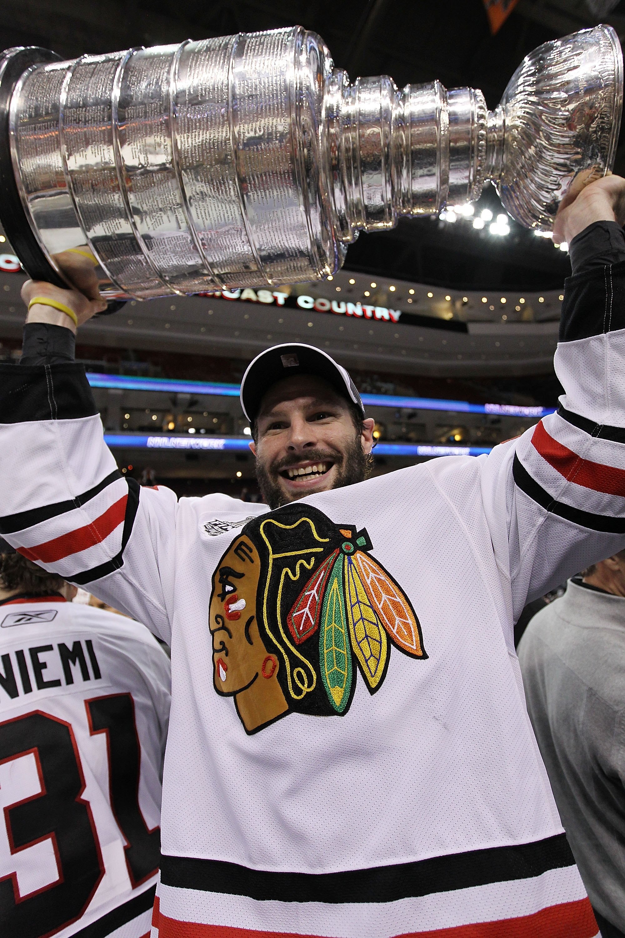 PHILADELPHIA - JUNE 09:  Troy Brouwer #22 of the Chicago Blackhawks hoists the Stanley Cup after the Blackhawks defeated the Philadelphia Flyers 4-3 in overtime to win the Stanley Cup in Game Six of the 2010 NHL Stanley Cup Final at the Wachovia Center on