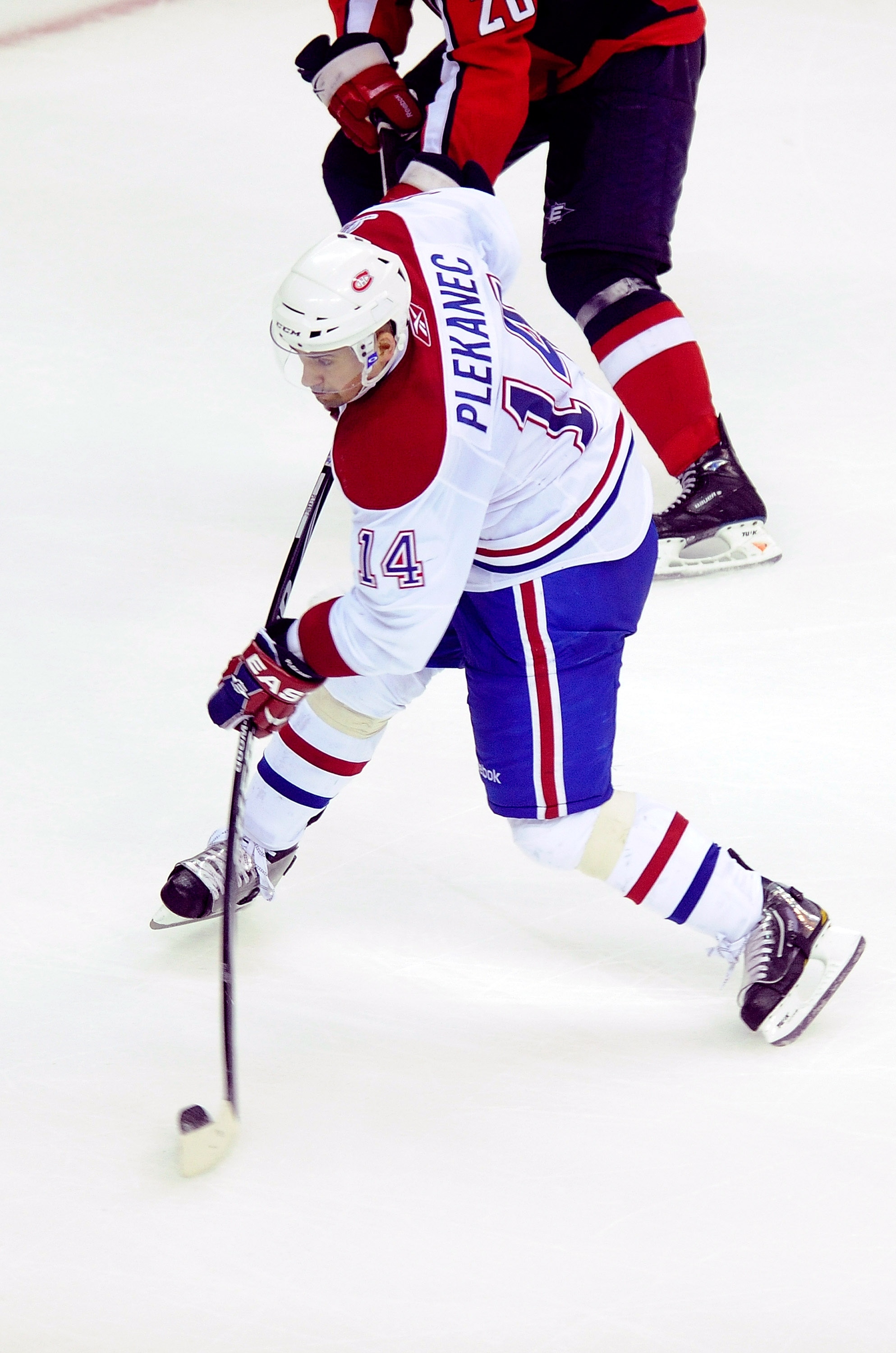 WASHINGTON - APRIL 15:  Tomas Plekanec #14 of the Montreal Canadiens shoots and scores the game-winning goal in overtime against the Washington Capitals in Game One of the Eastern Conference Quarterfinals during the 2010 NHL Stanley Cup Playoffs at Verizo