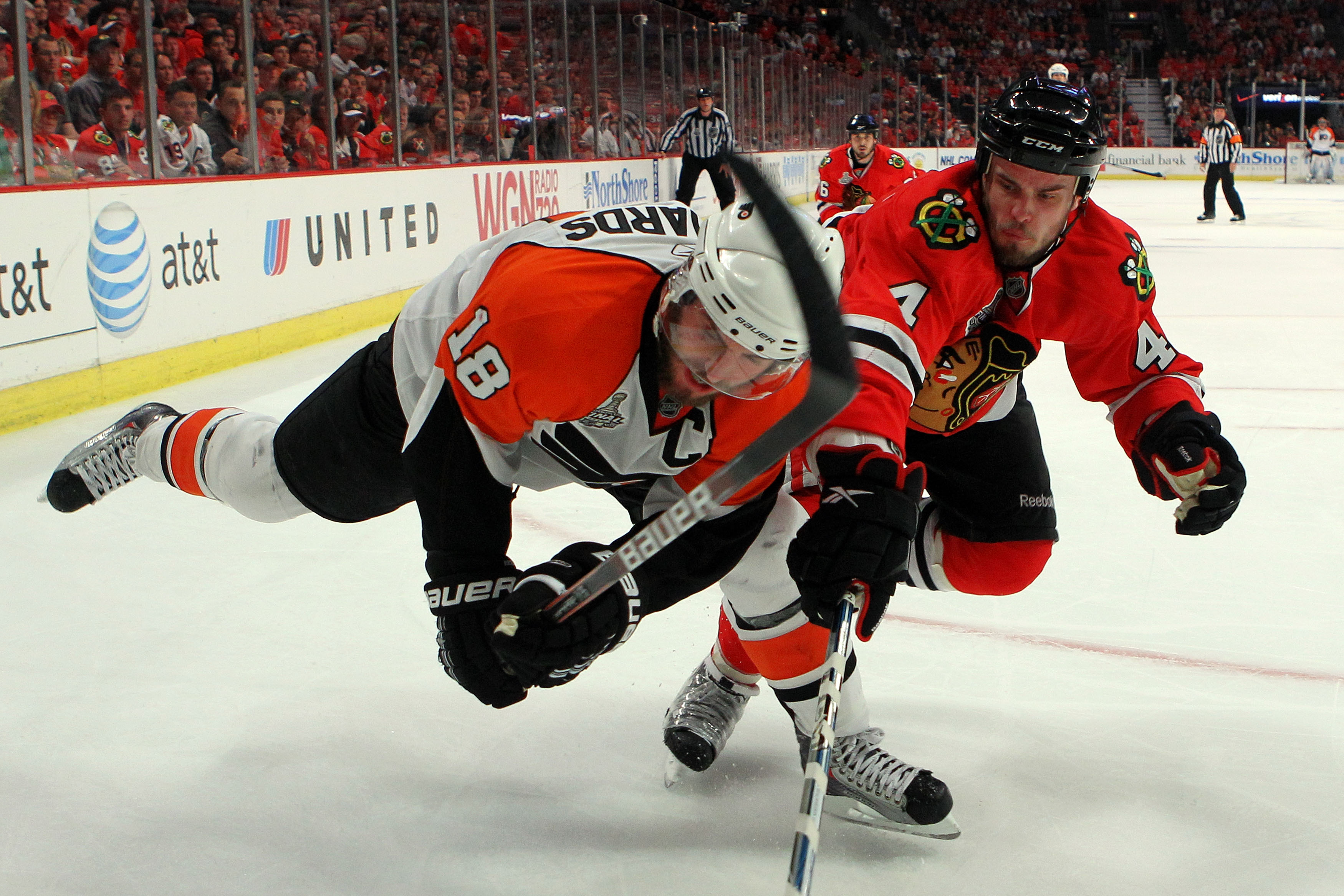 CHICAGO - JUNE 06:  Mike Richards #18 of the Philadelphia Flyers skates against Niklas Hjalmarsson #4 of the Chicago Blackhawks in Game Five of the 2010 NHL Stanley Cup Final at the United Center on June 6, 2010 in Chicago, Illinois.  (Photo by Bruce Benn