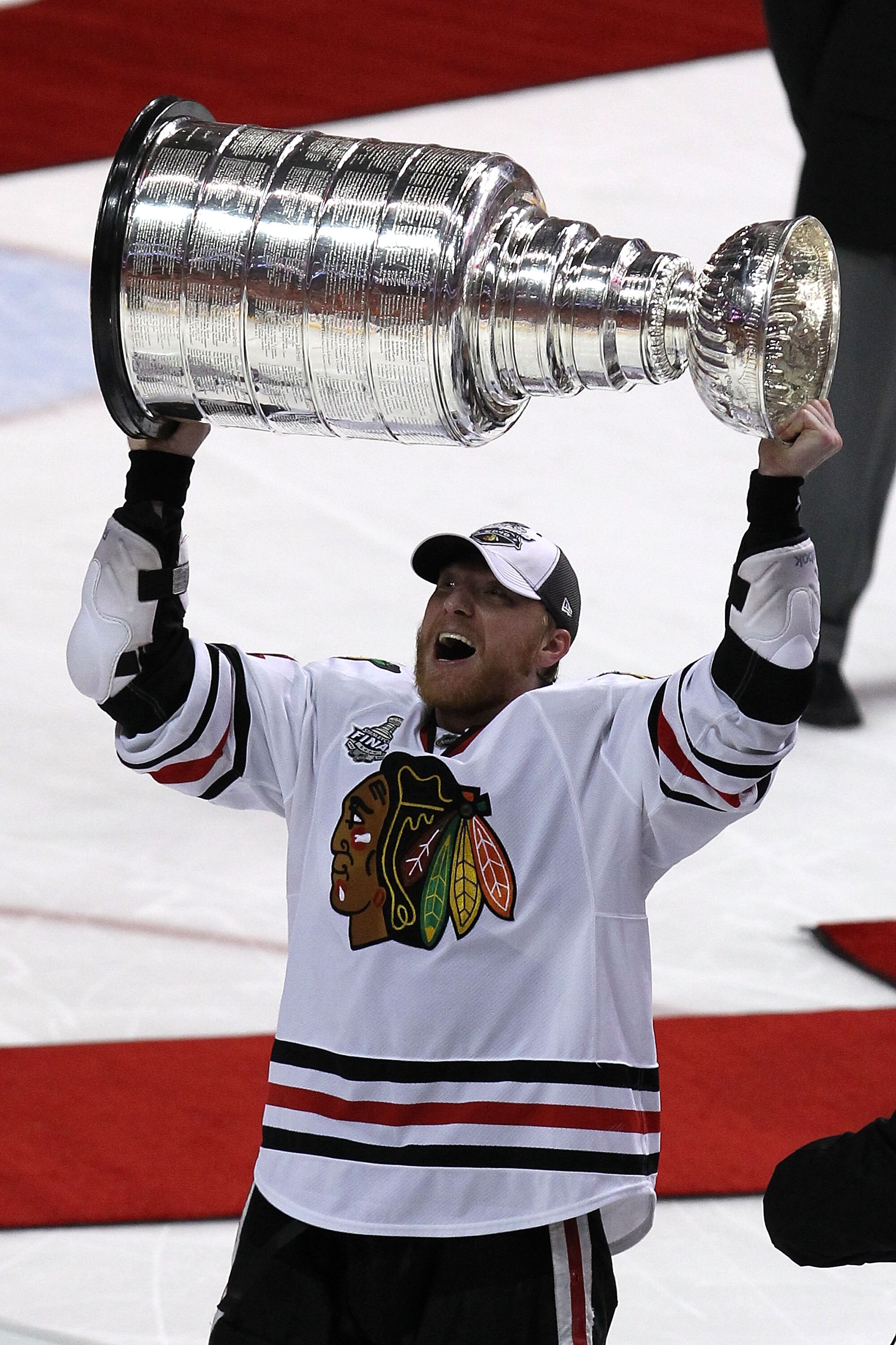 PHILADELPHIA - JUNE 09:  Marian Hossa #81 of the Chicago Blackhawks hoists the Stanley Cup after teammate Patrick Kane #88 scored the game-winning goal in overtime to defeat the Philadelphia Flyers 4-3 and win the Stanley Cup in Game Six of the 2010 NHL S