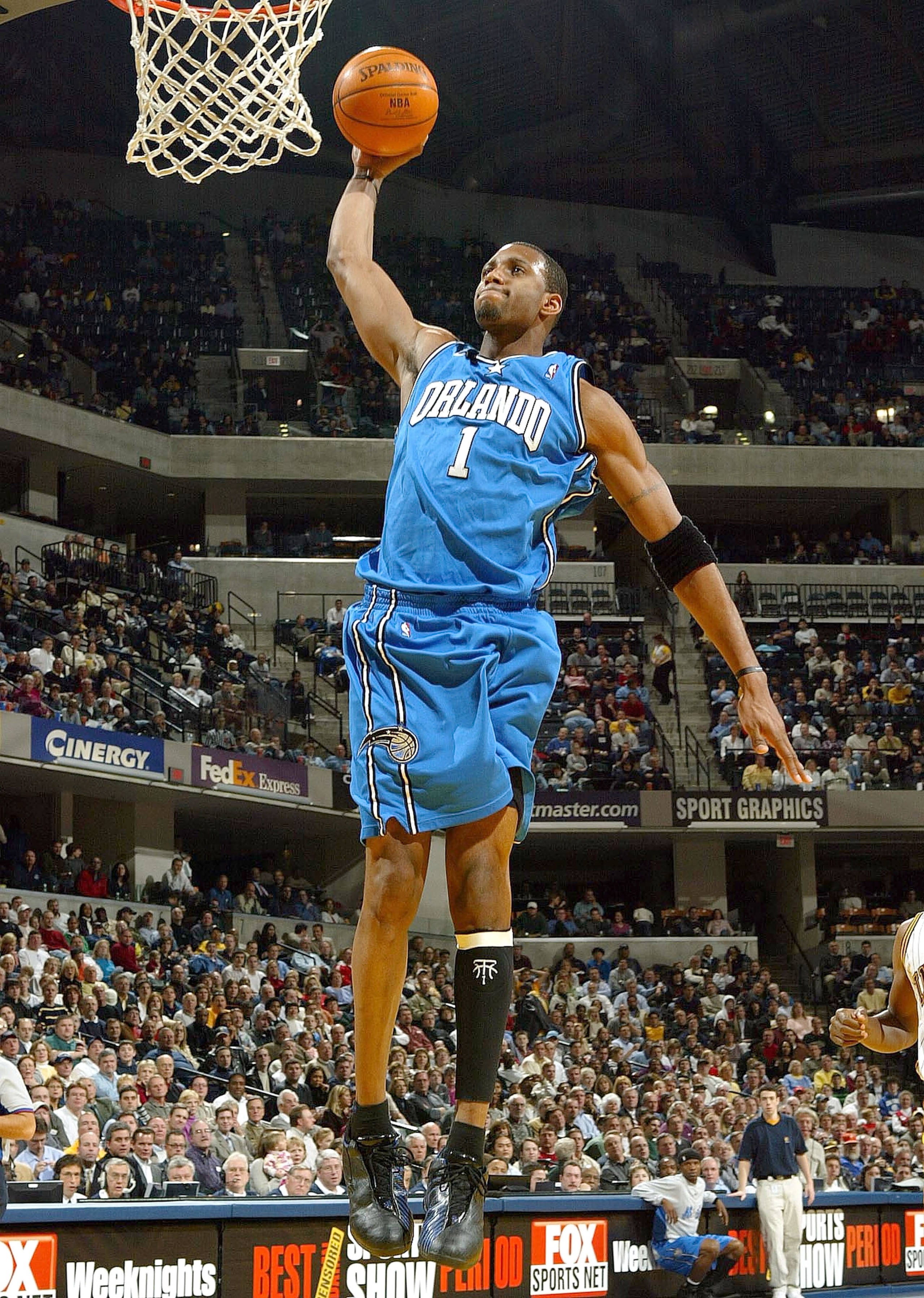 INDIANAPOLIS - DECEMBER 17: Tracy McGrady #1 of the Orlando Magic dunks the ball against the Indiana Pacers on December17, 2003 at Conseco Fieldhouse in Indianapolis, Indiana. The Magic won 94-90. (Photo by Andy Lyons/Getty Images) INDIANAPOLIS - DECEMBER 17: Tracy McGrady #1 of the Orlando Magic dunks the ball against the Indiana Pacers on December17, 2003 at Conseco Fieldhouse in Indianapolis, Indiana. The Magic won 94-90. (Photo by Andy Lyons/Getty Images)