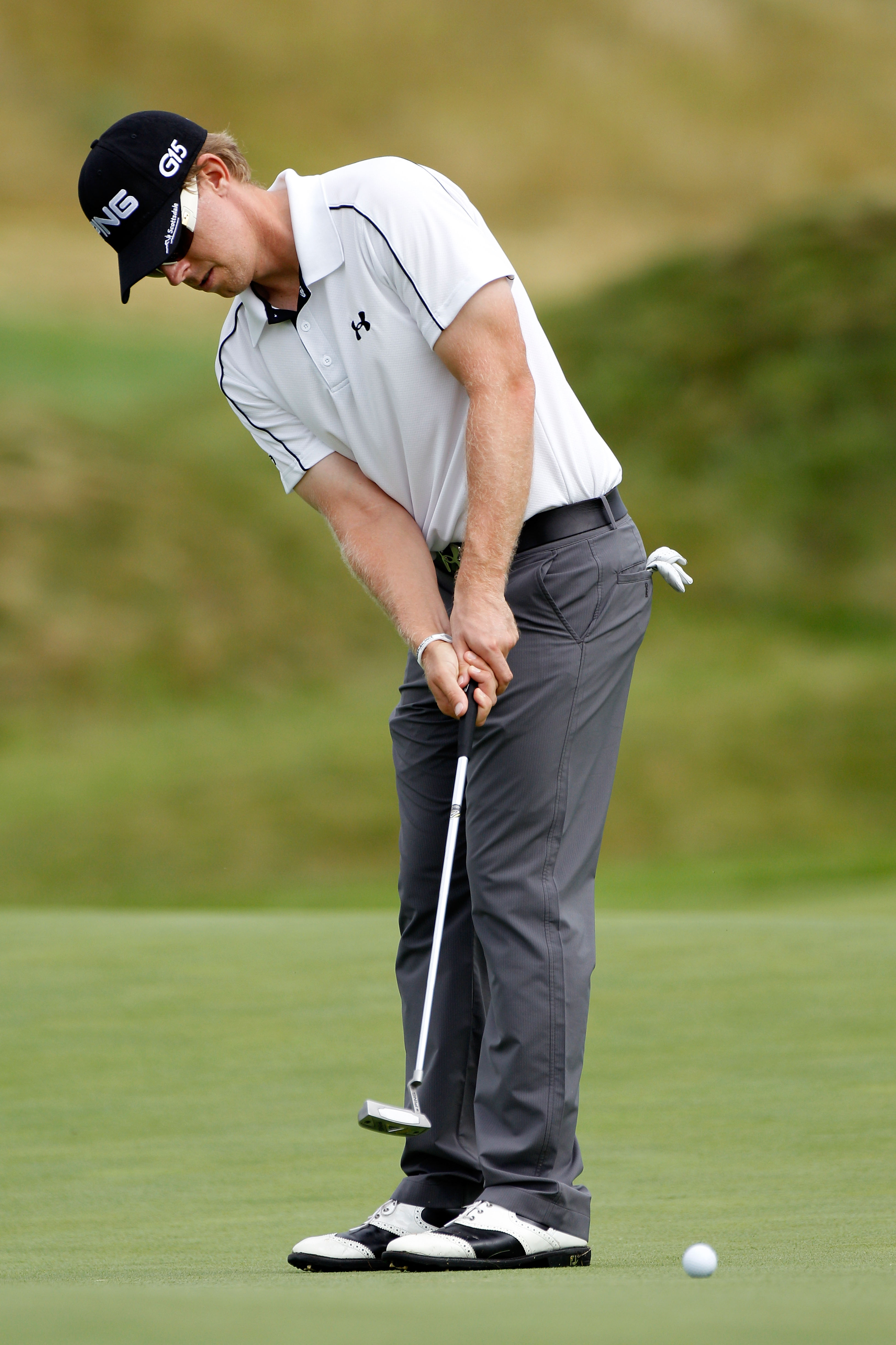 KOHLER, WI - AUGUST 11:  Hunter Mahan putts during a practice round prior to the start of the 92nd PGA Championship on the Straits Course at Whistling Straits on August 11, 2010 in Kohler, Wisconsin.  (Photo by Sam Greenwood/Getty Images)