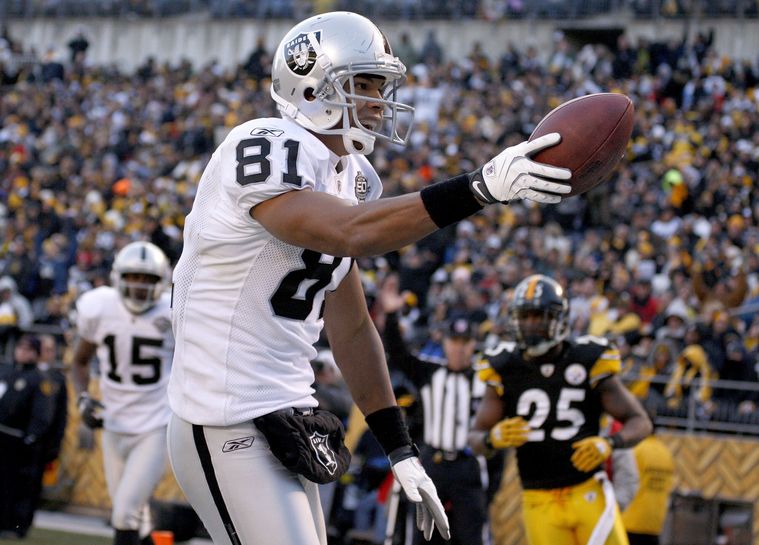 PITTSBURGH - DECEMBER 06:  Chaz Schilens #81 of the Oakland Raiders celebrates a fourth quarter touchdown while playing the Pittsburgh Steelers on December 6, 2009 at Heinz Field in Pittsburgh, Pennsylvania. Oakland won the game 27-24.  (Photo by Gregory