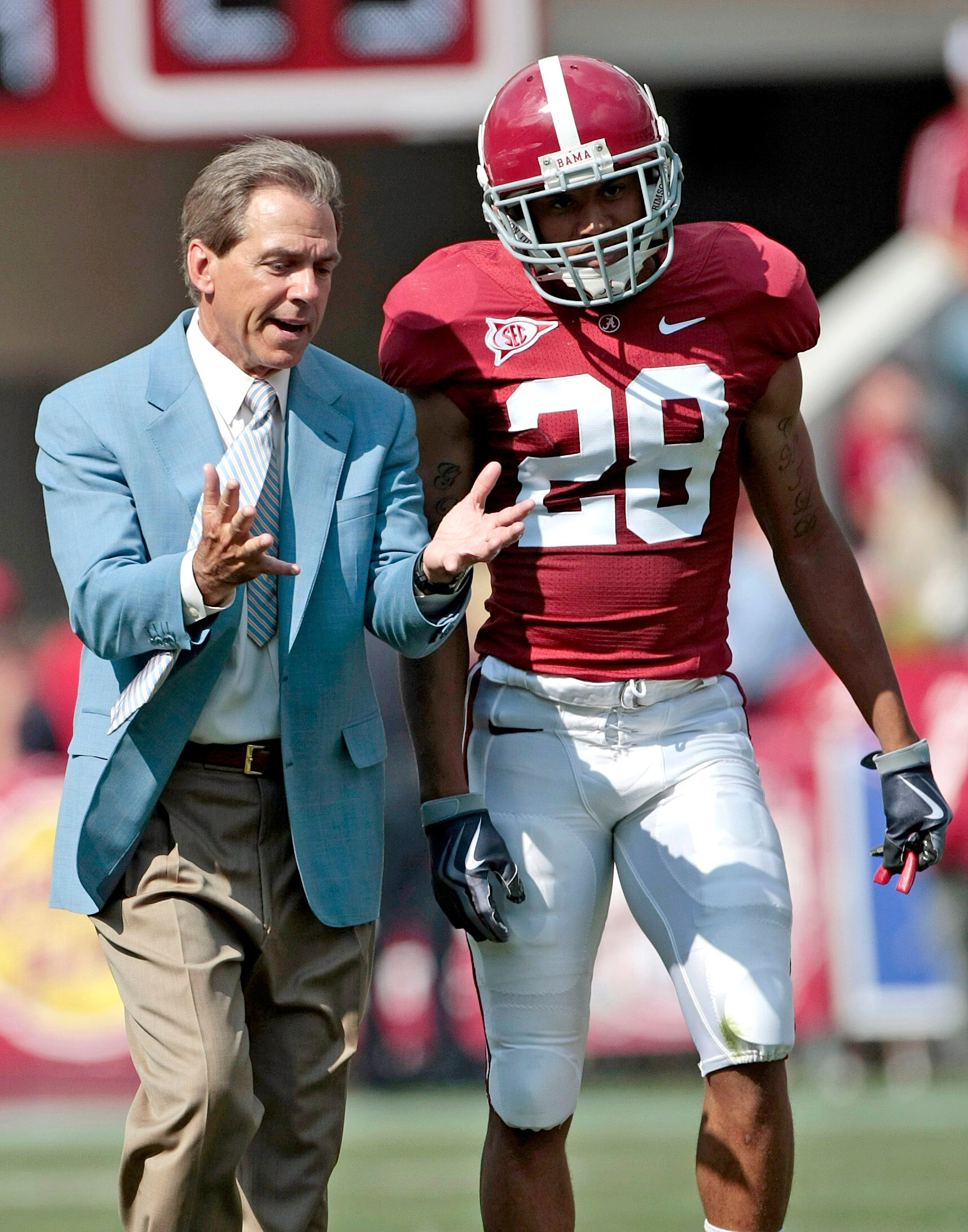 TUSCALOOSA, AL - APRIL 17: Coach Nick Saban of the Alabama Crimson Tide talks with defensive back DeMarcus Milliner #28 during the Alabama spring game at Bryant Denny Stadium on April 17, 2010 in Tuscaloosa, Alabama. (Photo by Dave Martin/Getty Images)