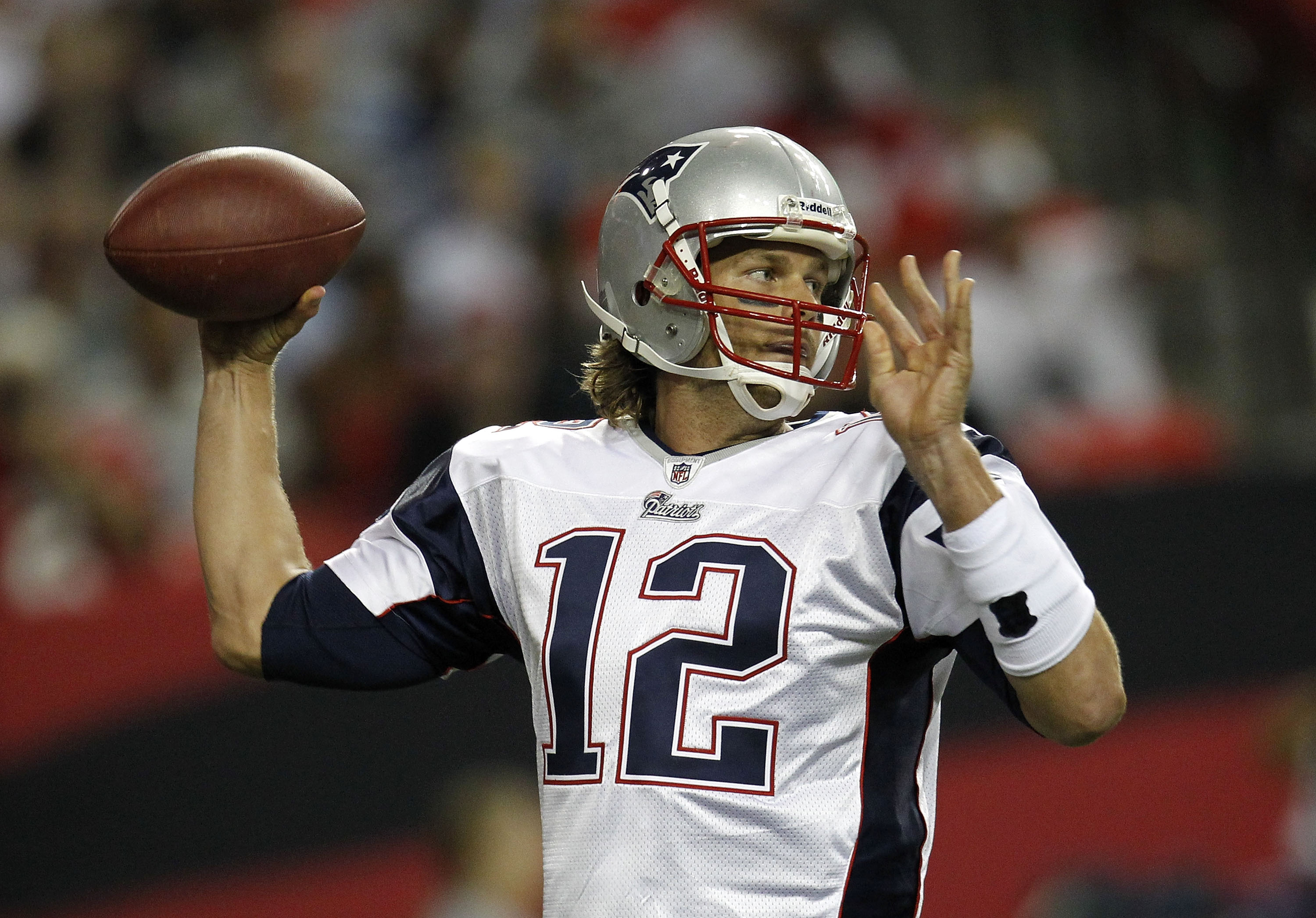 ATLANTA - AUGUST 19:  Quarterback Tom Brady #12 of the New England Patriots throws a pass during the preseason game against the Atlanta Falcons at the Georgia Dome on August 19, 2010 in Atlanta, Georgia.  (Photo by Mike Zarrilli/Getty Images)