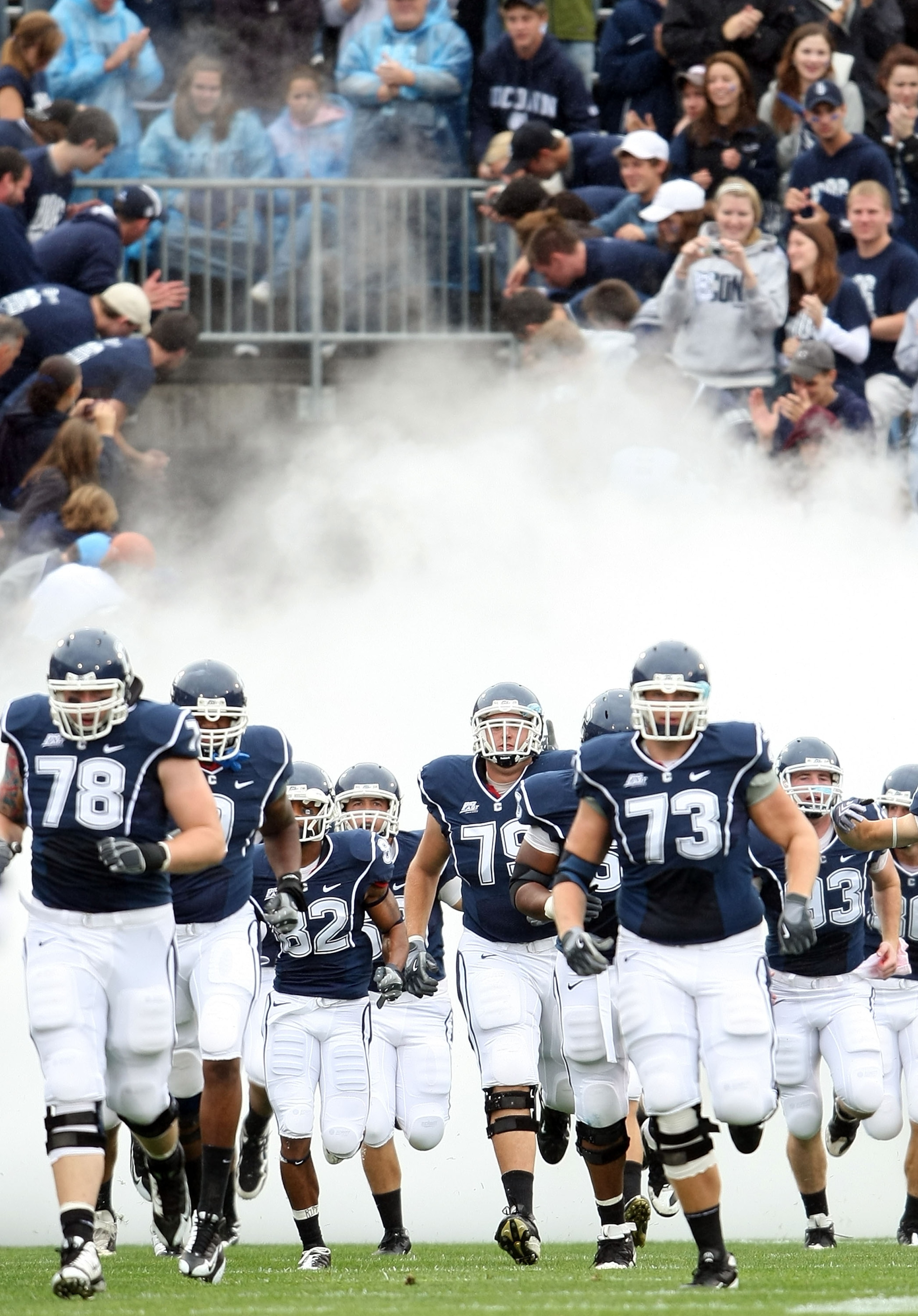 EAST HARTFORD, CT - SEPTEMBER 12:  The Connecticut Huskies enter the field before the game against  the North Carolinia Tar Heels on September 12, 2009 at Rentschler Field in East Hartford, Connecticut.  (Photo by Elsa/Getty Images)