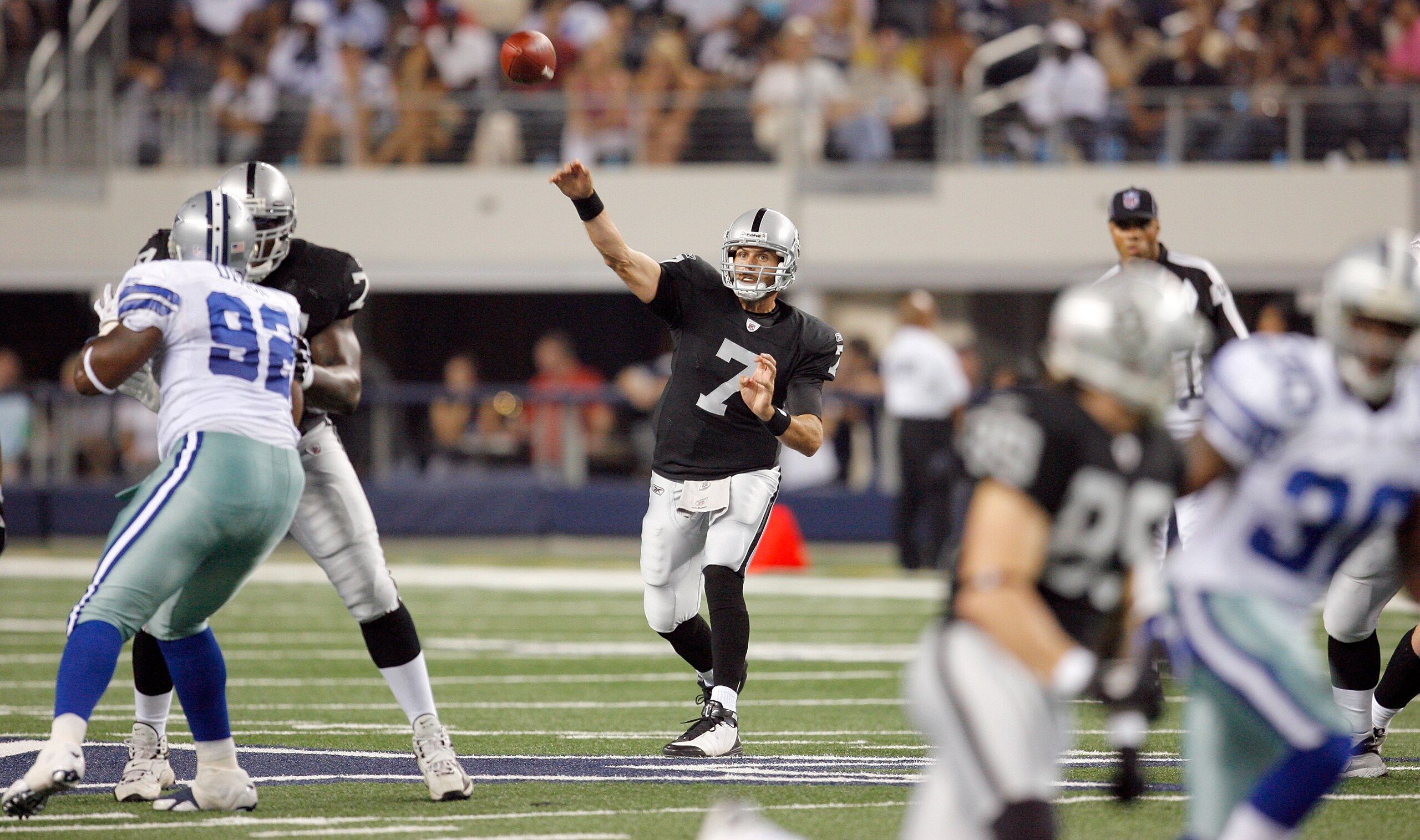 ARLINGTON, TX - AUGUST 12:  Kyle Boller #7 of the Oakland Raiders throws to a receiver in the preseason game against the Dallas Cowboys at Dallas Cowboys Stadium on August 12, 2010 in Arlington, Texas.  (Photo by Tom Pennington/Getty Images)