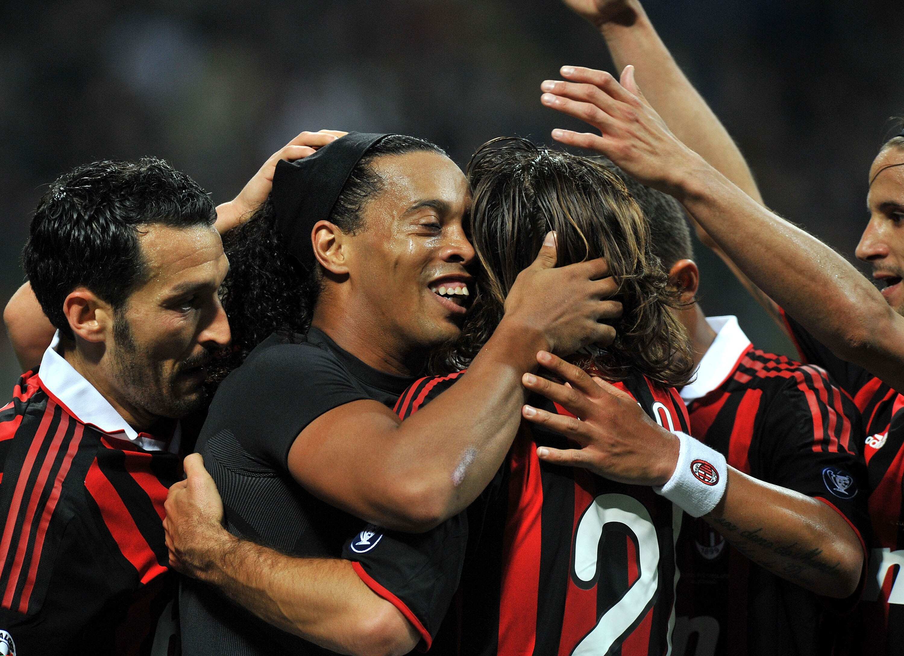 MILAN, ITALY - MAY 15:  Players of AC Milan celebrate  their team's third goal scored by Ronaldinho during the Serie A match between AC Milan and Juventus FC at Stadio Giuseppe Meazza on May 15, 2010 in Milan, Italy.  (Photo by Massimo Cebrelli/Getty Imag