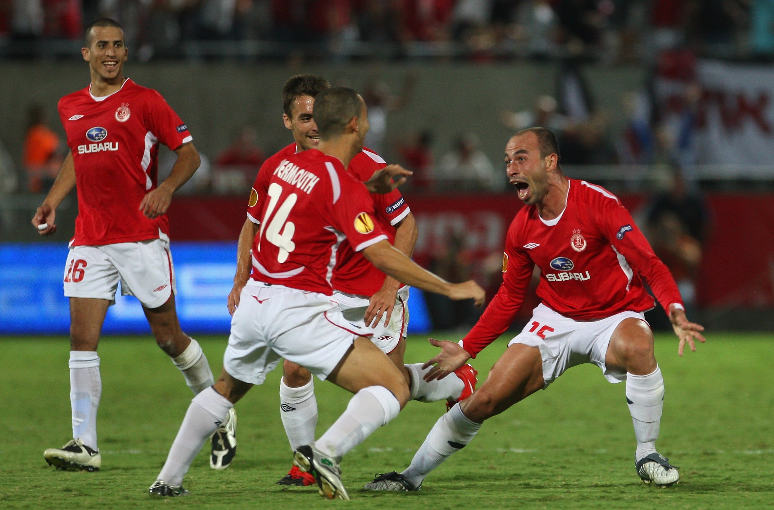 TEL AVIV, ISRAEL - OCTOBER 22:  Hapoel Tel Aviv's Zurab Menteshashvili (15), at right, celebrates his 2nd half goal during their UEFA Europa League group C match between Hapoel Tel Aviv FC and SK Rapid Vienna at Bloomfield stadium on October 22, 2009 in T