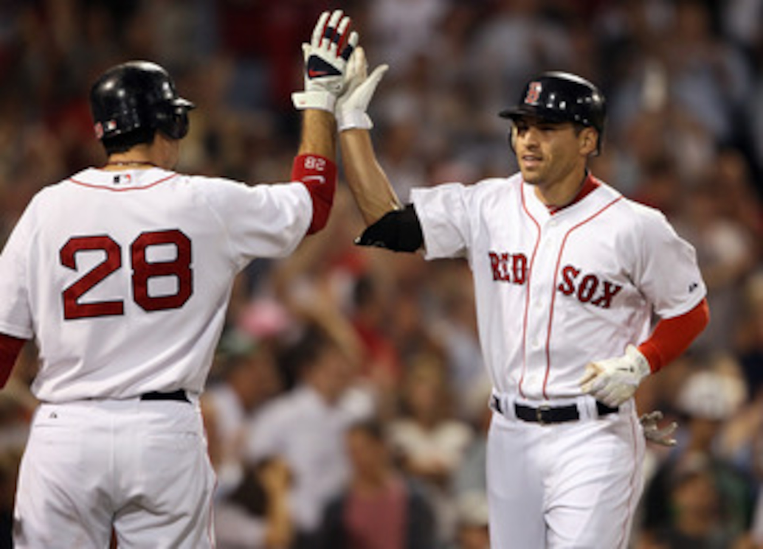 BOSTON, MA - AUGUST 31:  Jacoby Ellsbury #2 of the Boston Red Sox is congratulated by teammate Adrian Gonzalez #28 after Ellsbury hit a two run homer in the sixth inning against the New York Yankees on August 31, 2011 at Fenway Park in Boston, Massachuset
