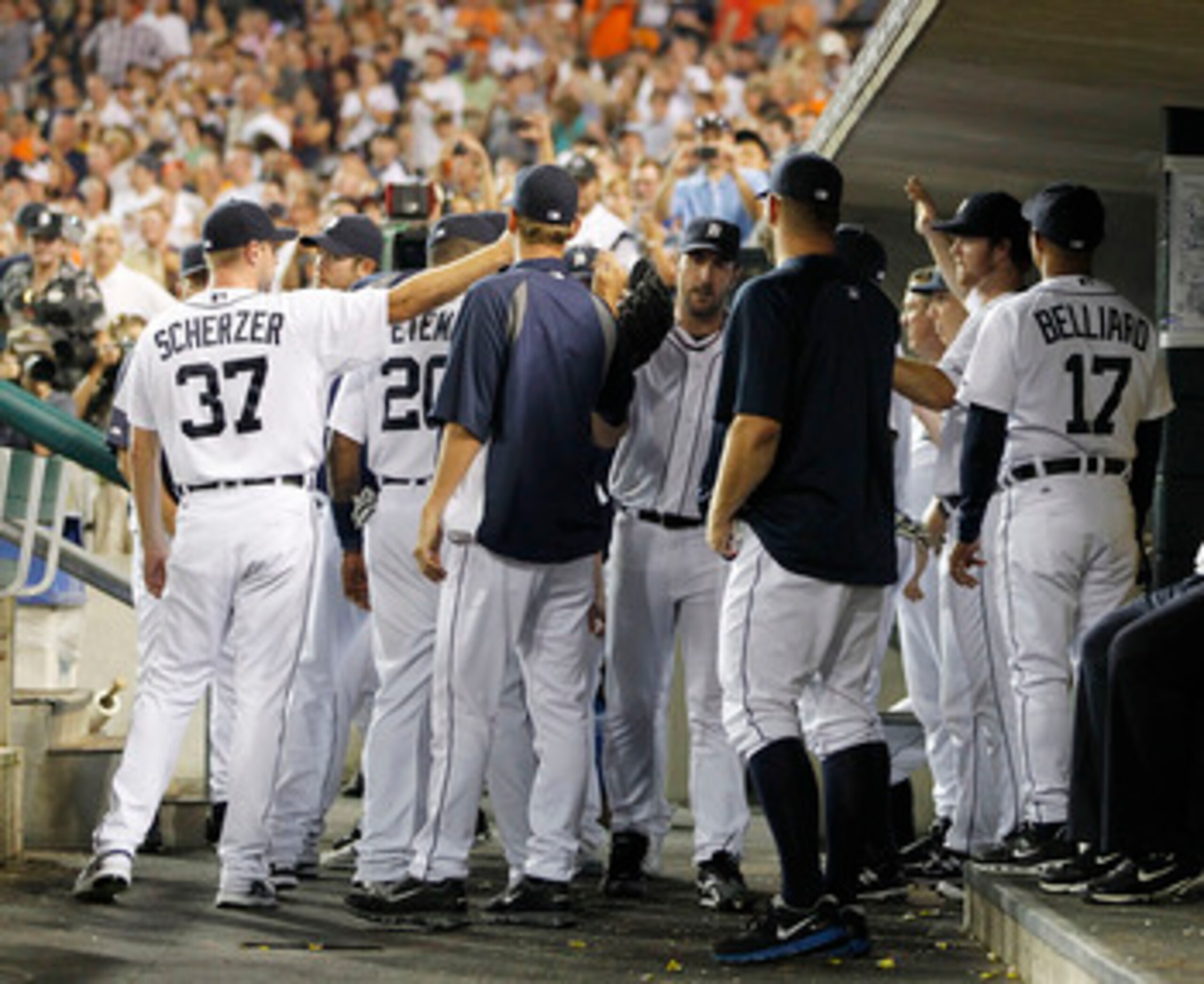 DETROIT - SEPTEMBER 02:  Justin Verlander #35 of the Detroit Tigers is congratulated by his teammates after  being removed from the game for a pitching change in the eighth inning against the Chicago White Sox at Comerica Park on September 2, 2011 in Detr