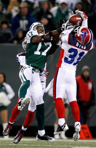 Byrd fights Jets' receiver Braylon Edwards for one of his nine interceptions.