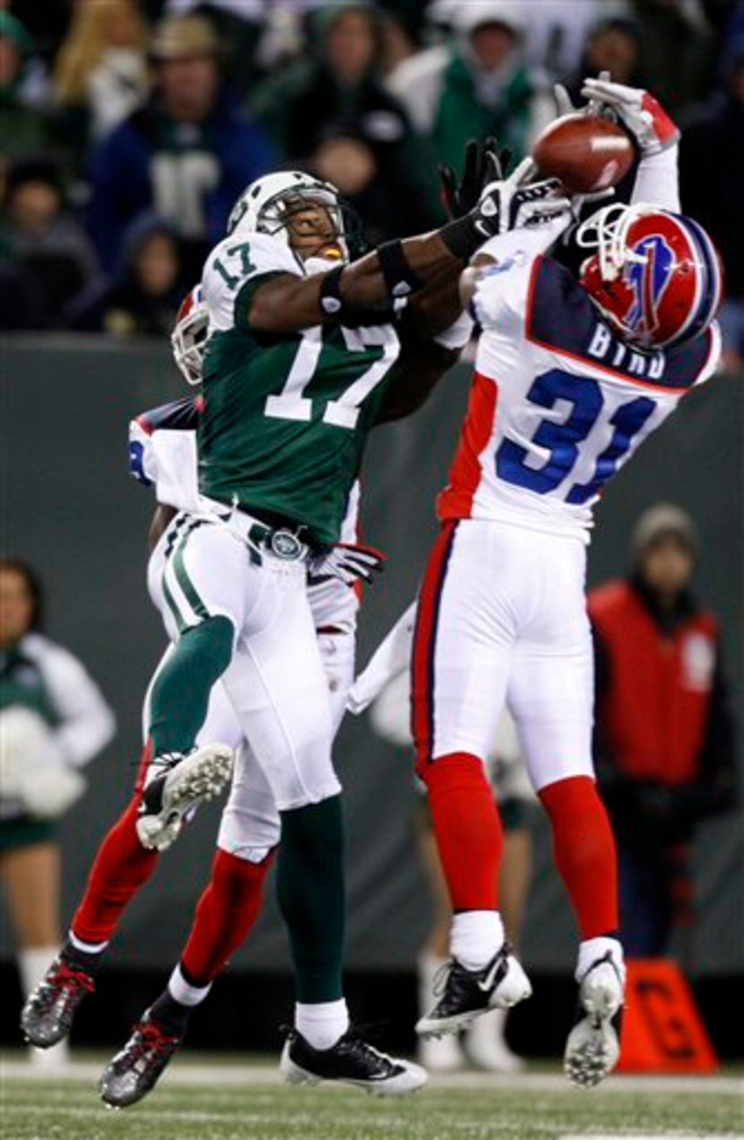Byrd fights Jets' receiver Braylon Edwards for one of his nine interceptions.