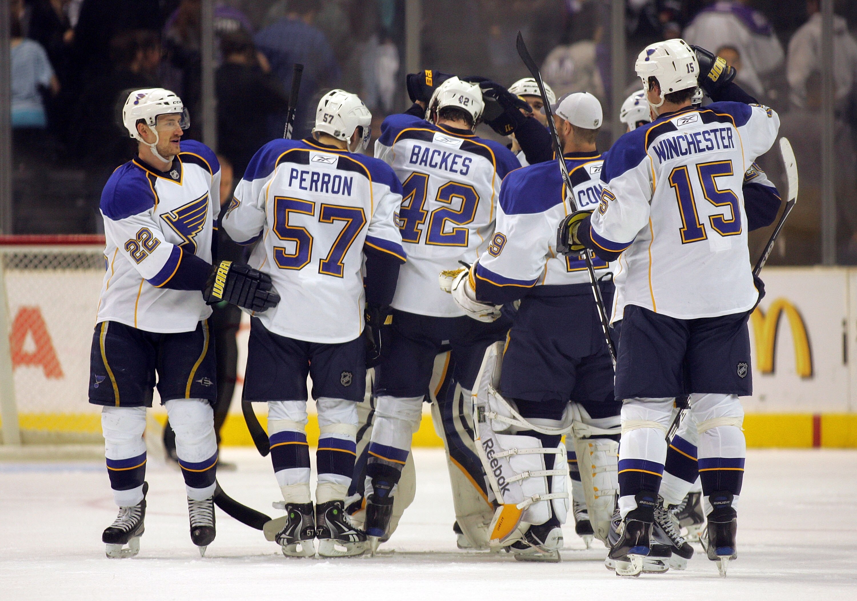 LOS ANGELES, CA - JANUARY 09:  Brad Boyes #22, David Perron #57, David Backes #42, backup goaltender Ty Conklin #29 and Brad Winchester #15 of the St. Louis Blues crowd around teammate goaltender Chris Mason #50 after they defeated the Los Angeles Kings 4