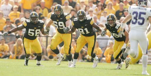 Iowa's Lebron Daniel, Kyle Haganman, Broderick Binns and Karl Klug head toward Northwestern during a kick off return at Kinnick Stadium in 2008