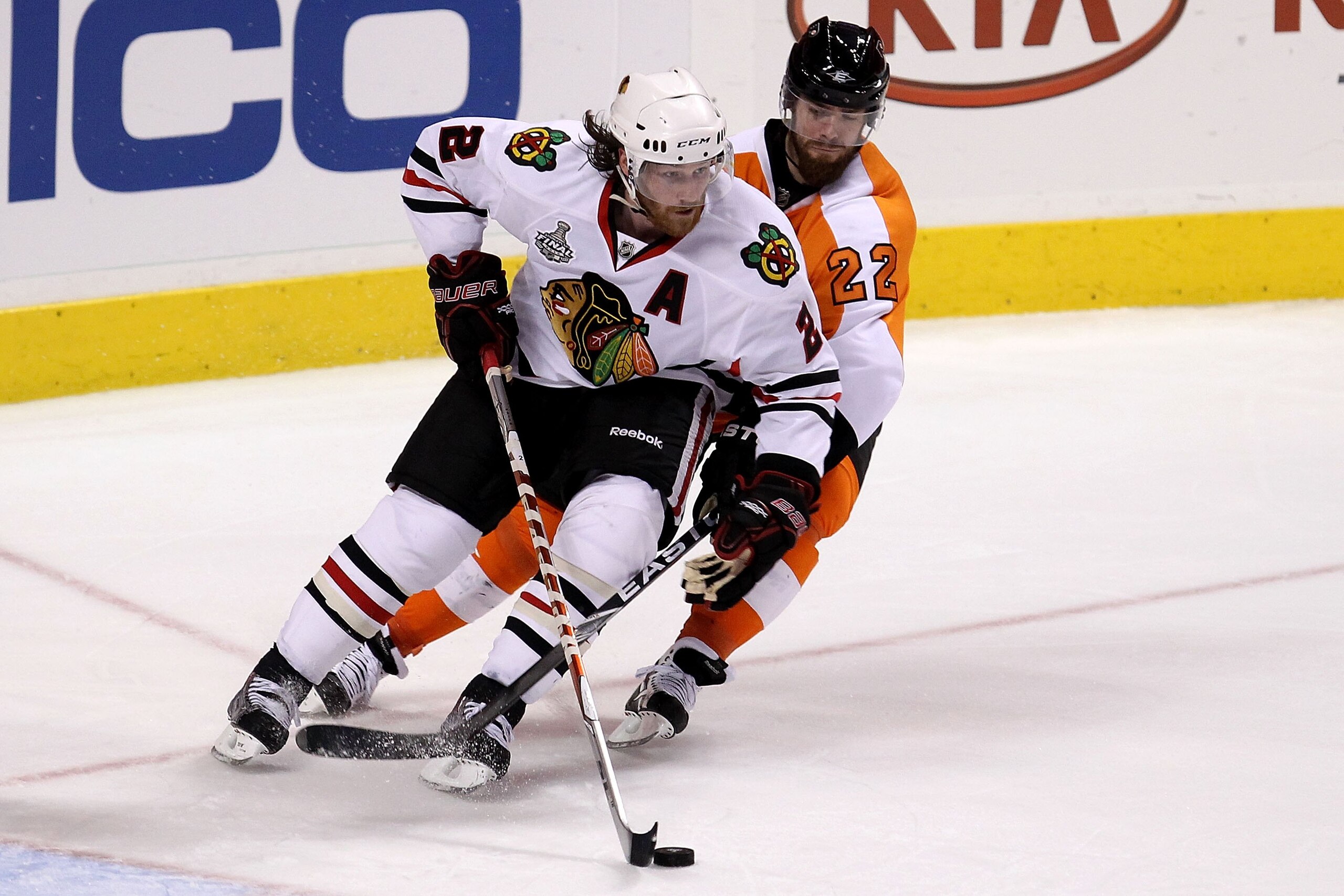 PHILADELPHIA - JUNE 04:  Duncan Keith #2 of the Chicago Blackhawks fights for the puck against Ville Leino #22 of the Philadelphia Flyers in Game Four of the 2010 NHL Stanley Cup Final at Wachovia Center on June 4, 2010 in Philadelphia, Pennsylvania.  (Ph