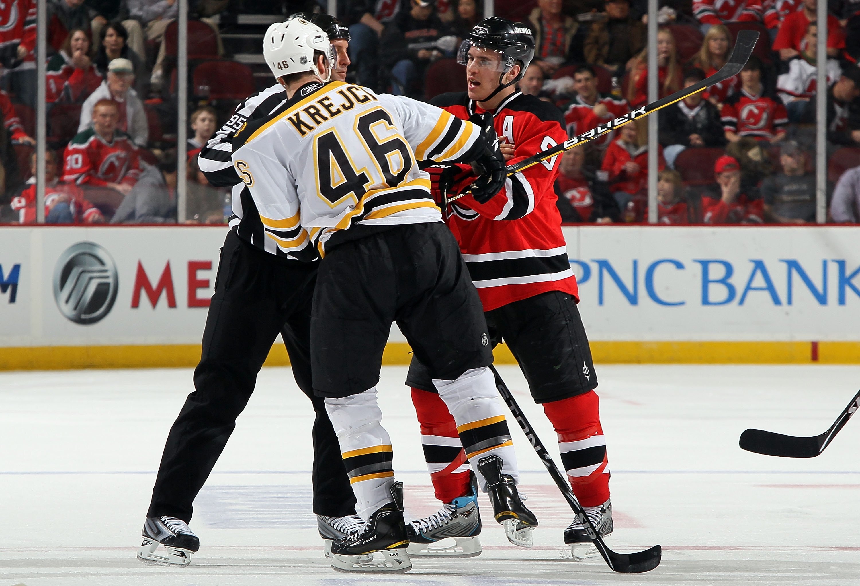NEWARK, NJ - MARCH 30:  David Krejci #46 of the Boston Bruins skates against Zach Parise #9 of the New Jersey Devils at the Prudential Center on March 30, 2010 in Newark, New Jersey. The Bruins defeated the Devils 1-0 in overtime.  (Photo by Jim McIsaac/G