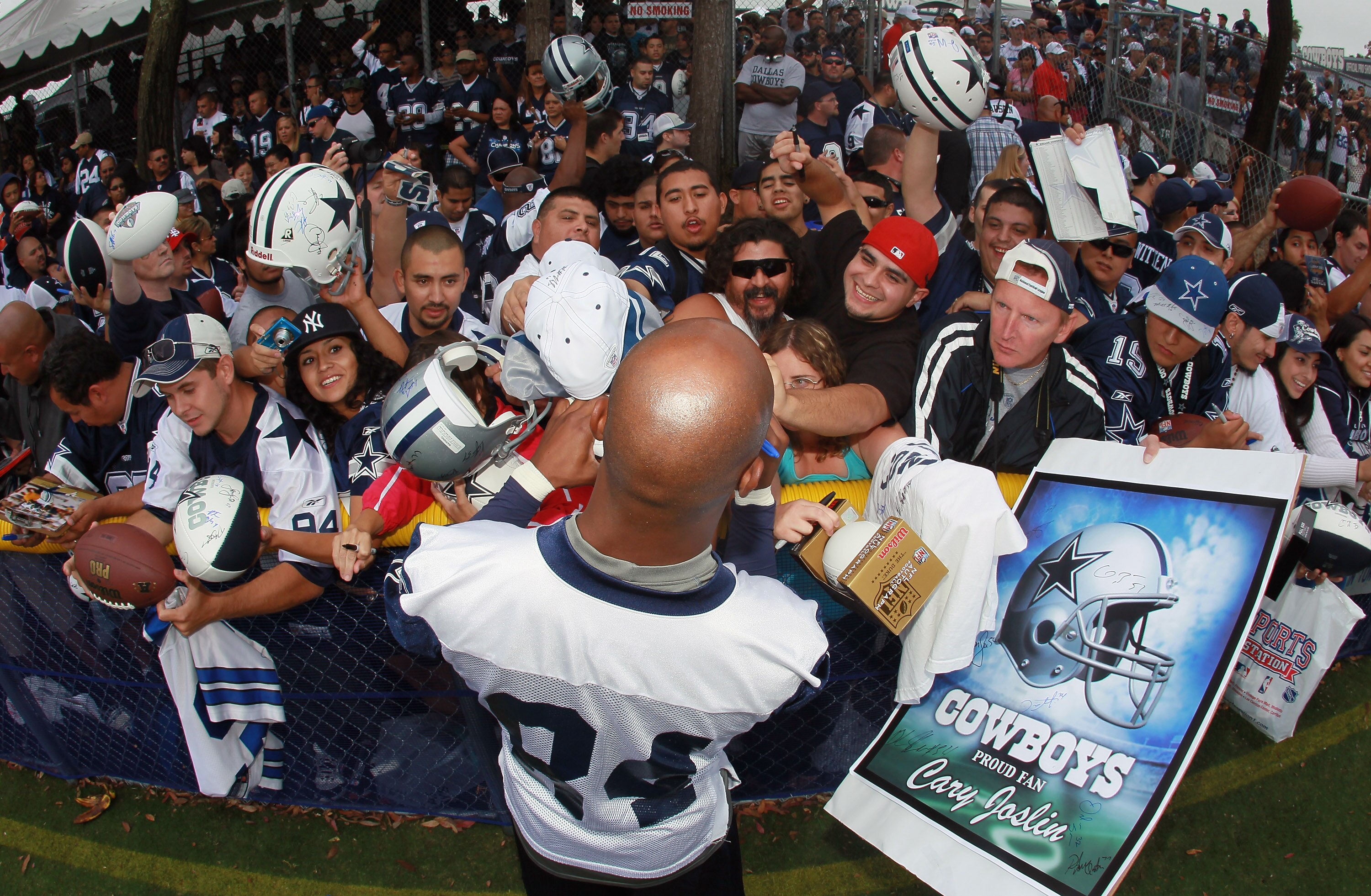 OXNARD, CA - AUGUST 14:  Wide receiver Patrick Crayton #84 signs autographs for fans during Dallas Cowboys Training Camp at the Marriott Residence Inn Oxnard River Ridge on August 14, 2010 in Oxnard, California.  (Photo by Jeff Gross/Getty Images)