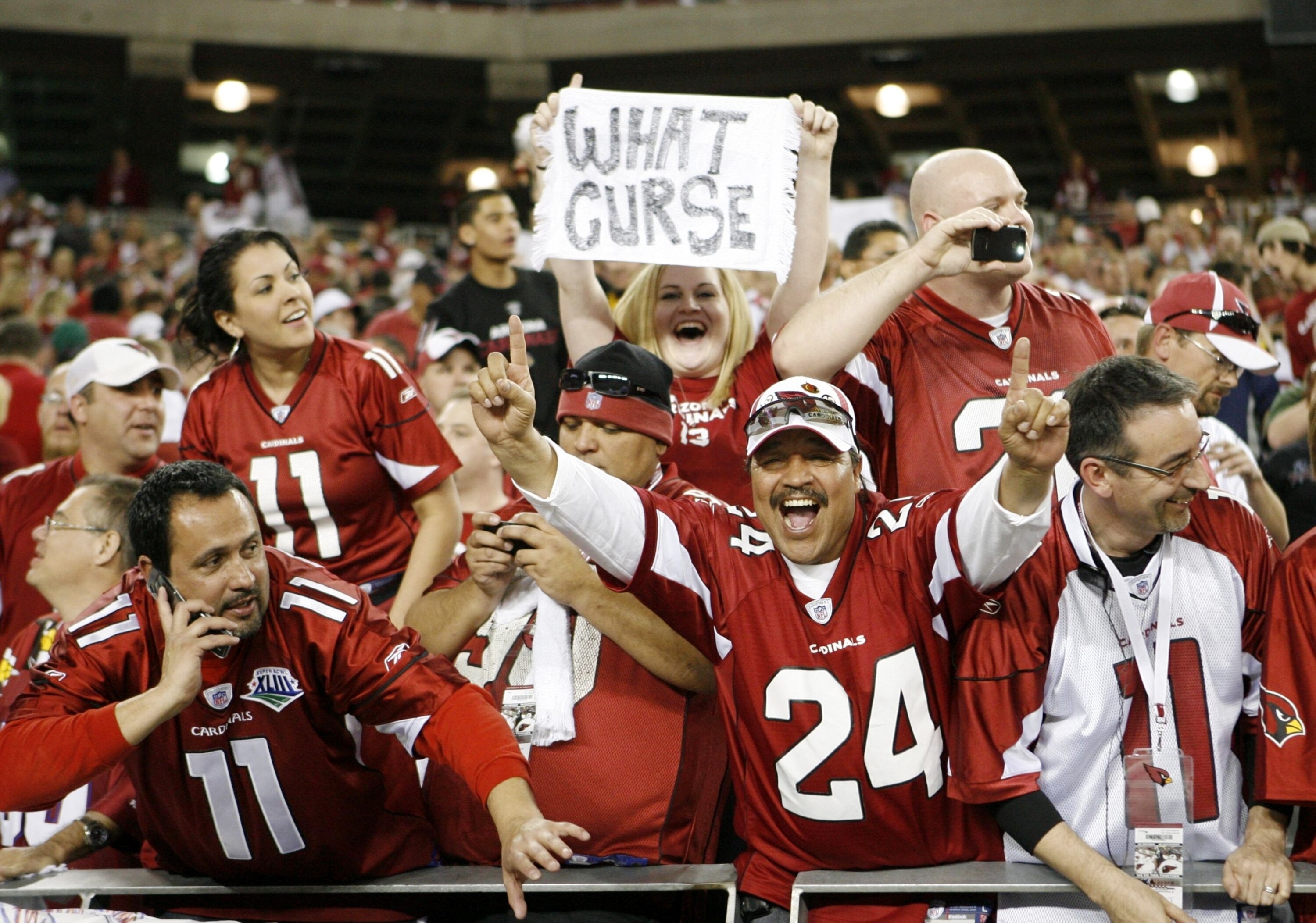 GLENDALE, AZ - JANUARY 10:  Arizona Cardinals fans celebrate after their team won the 2010 NFC wild-card playoff game 51-45 over the Green Bay Packers in overtime at University of Phoenix Stadium on January 10, 2010 in Glendale, Arizona.  (Photo by Christ