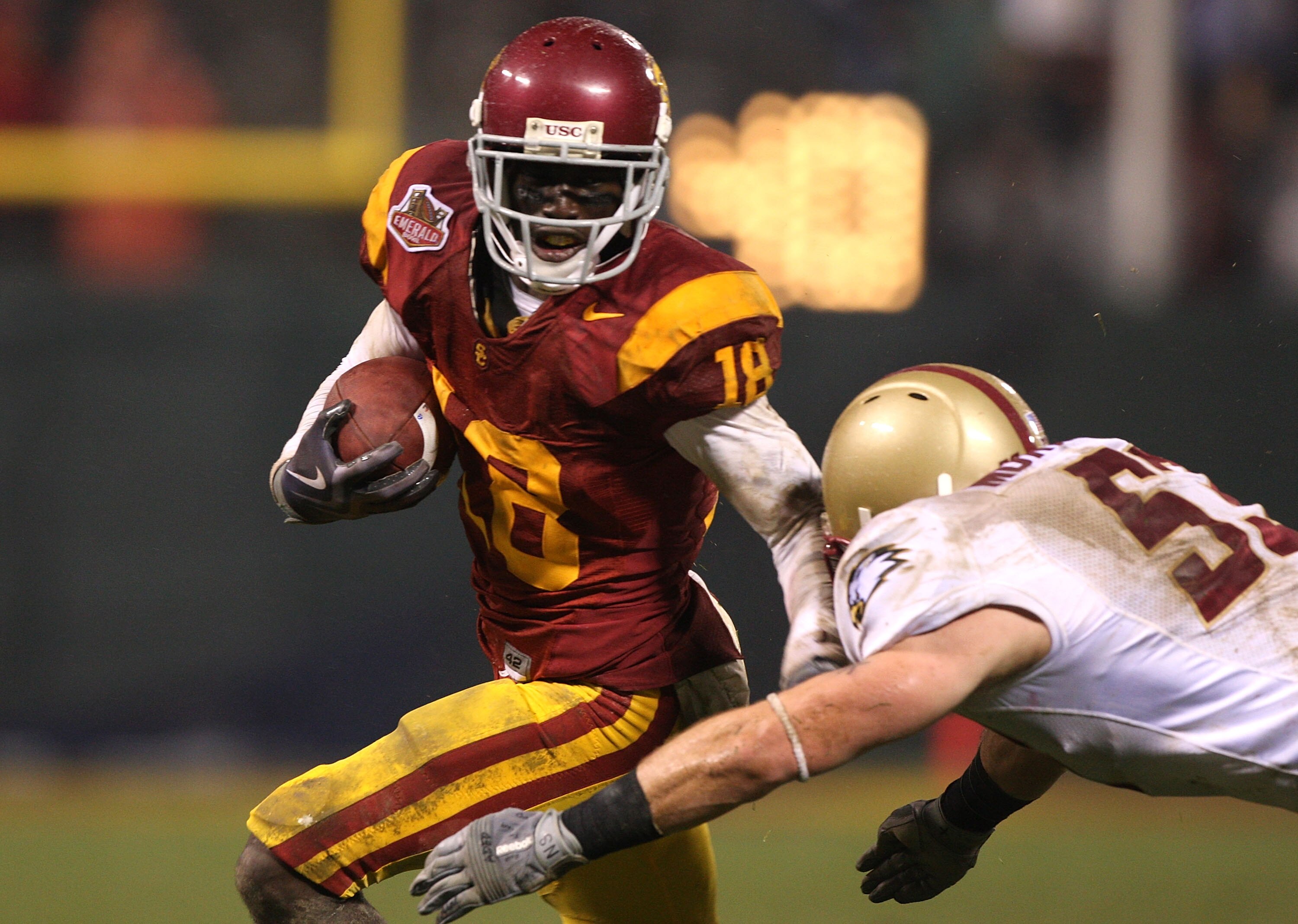 SAN FRANCISCO - DECEMBER 26: Damian Williams #18 of the USC Trojans runs after a catch against Mike Morrissey #53 of the Boston College Eagles during the 2009 Emerald Bowl at AT&T Park on December 26, 2009 in San Francisco, California. (Photo by Jed Jacob