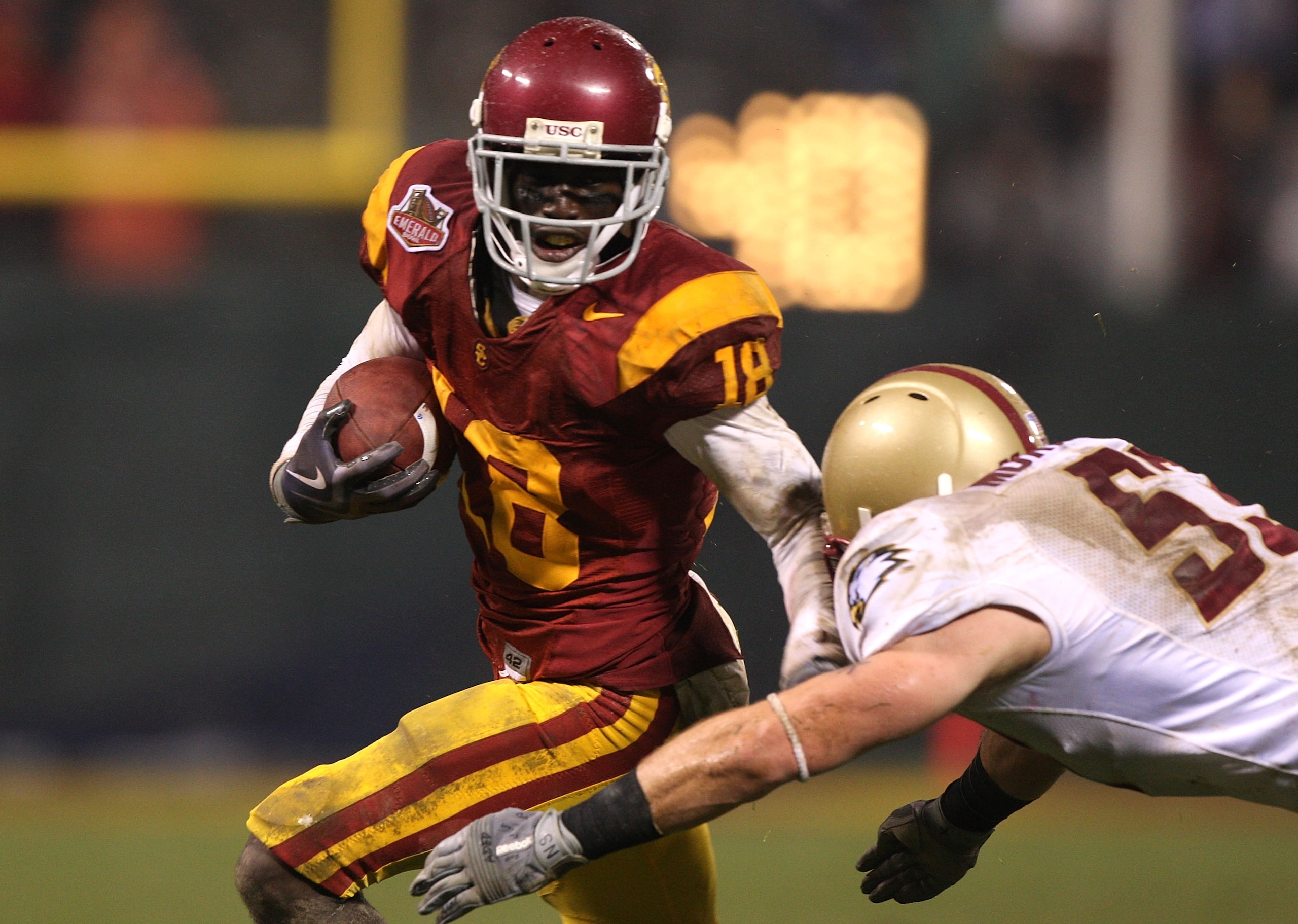 SAN FRANCISCO - DECEMBER 26: Damian Williams #18 of the USC Trojans runs after a catch against Mike Morrissey #53 of the Boston College Eagles during the 2009 Emerald Bowl at AT&T Park on December 26, 2009 in San Francisco, California. (Photo by Jed Jacob