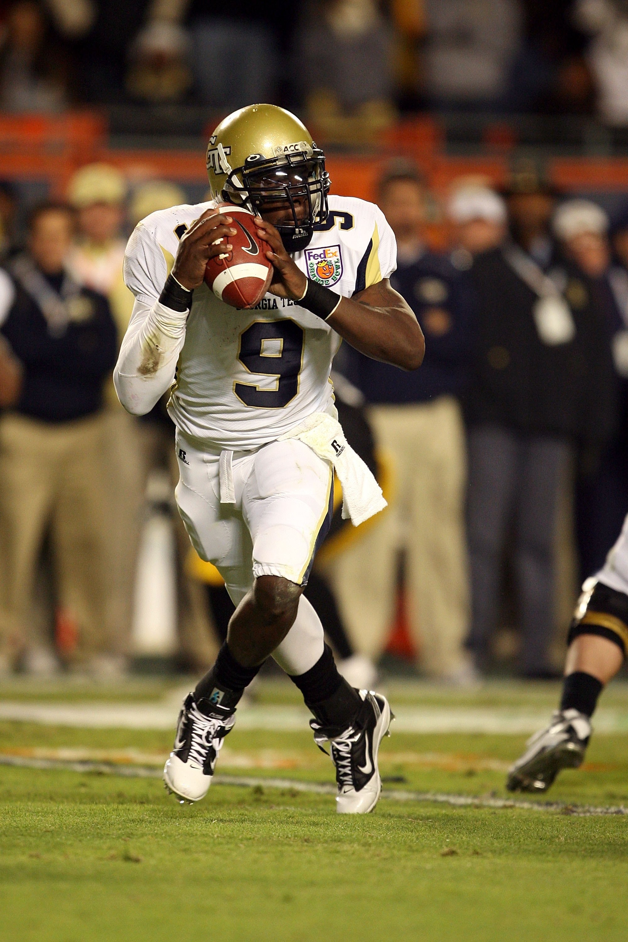 MIAMI GARDENS, FL - JANUARY 05:  Quarterback Josh Nesbitt #9 of the Georgia Tech Yellow Jackets rolls out against the Iowa Hawkeyes during the FedEx Orange Bowl at Land Shark Stadium on January 5, 2010 in Miami Gardens, Florida. Iowa won 24-14.  (Photo by