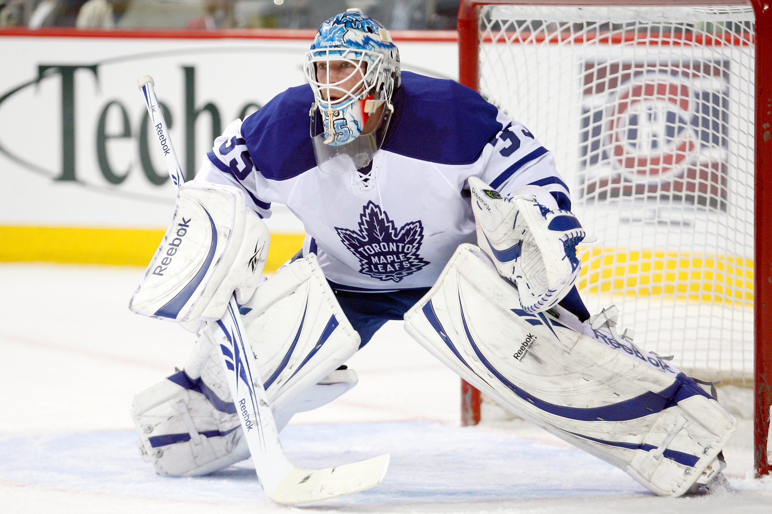 MONTREAL- APRIL 10: Jean-Sebastien Giguere #35 of the Toronto Maple Leafs watches play during the NHL game against the Montreal Canadiens on April 10, 2010 at the Bell Centre in Montreal, Quebec, Canada. The Maple Leafs defeated the Canadiens 4-3 in ove MONTREAL- APRIL 10: Jean-Sebastien Giguere #35 of the Toronto Maple Leafs watches play during the NHL game against the Montreal Canadiens on April 10, 2010 at the Bell Centre in Montreal, Quebec, Canada. The Maple Leafs defeated the Canadiens 4-3 in ove